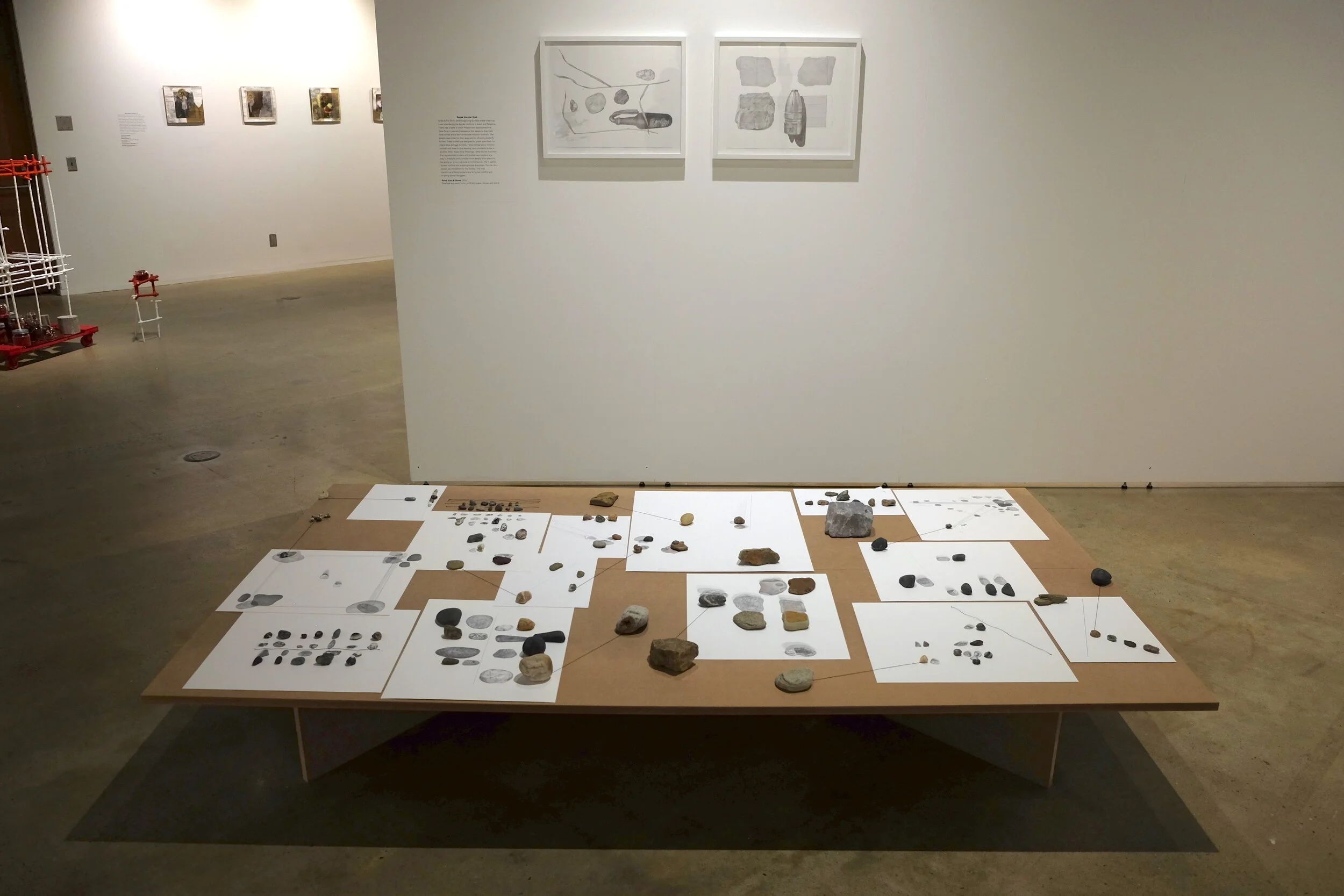   Point, Line &amp; Stone , 2019, graphite and pencil color on Bristol, stones, thread, stand. Wall:  Stem, Stone &amp; Molotov Cocktail , 2018 &amp;  Stone &amp; Butterfly Bullet , 2018. Installation Phillips Museum of Art, Lancaster, PA 