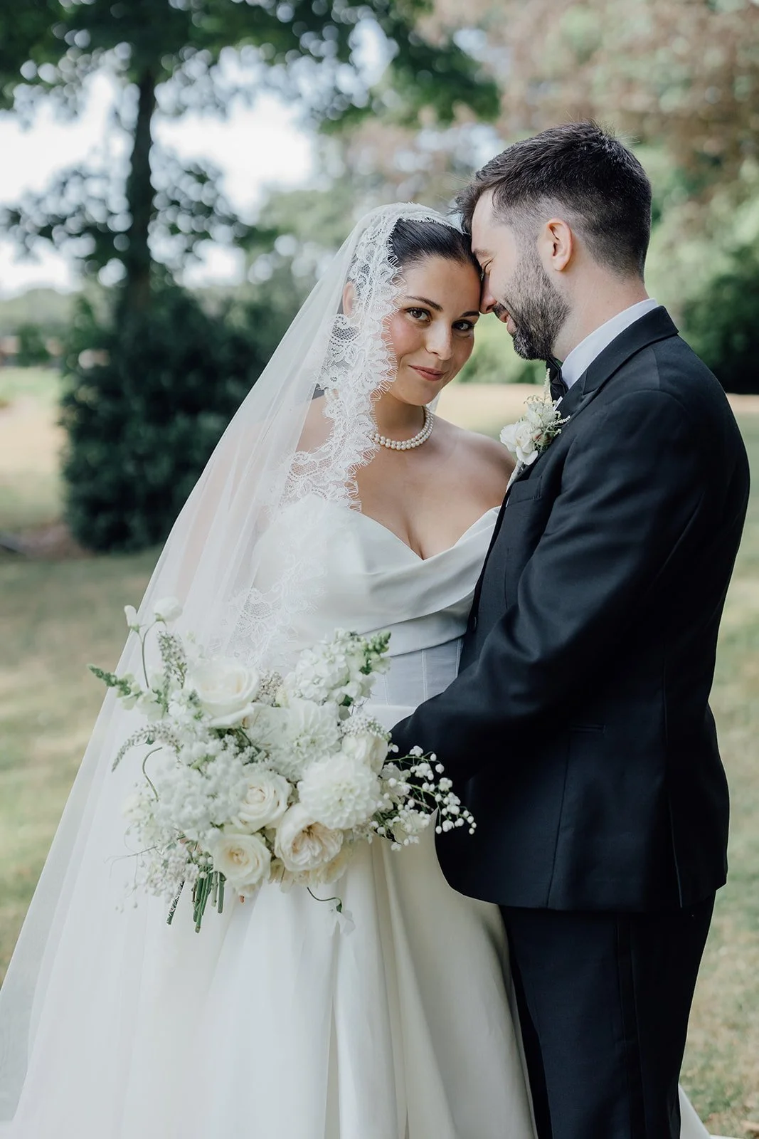 Bride and groom close portrait, bride in her cathedral veil Castlemartyr Resort
