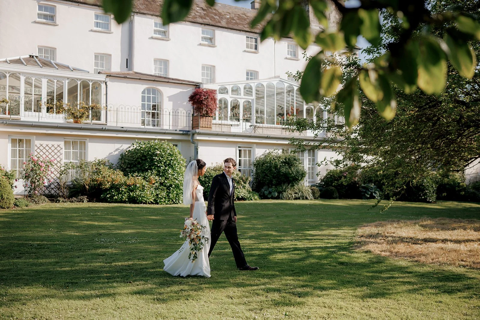 Destination couple Vella and John Garet capturing golden hour at the renowned Ballymaloe House in East Cork, Ireland. Full wedding planning provided by Amy Daunt Events