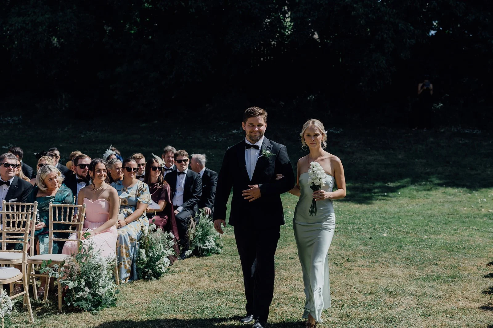 Bestman and bridesmaid walking down the aisle at Castlemartyr Resort
