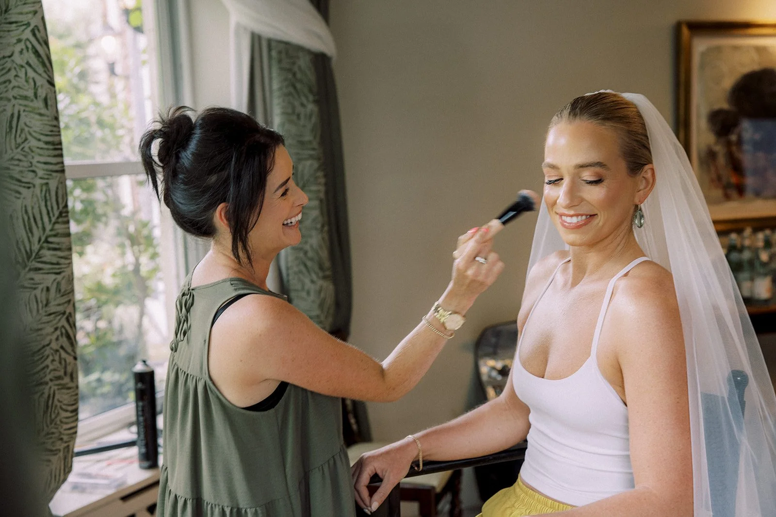 Bride getting her make up done morning of the wedding at Sheen Falls Lodge