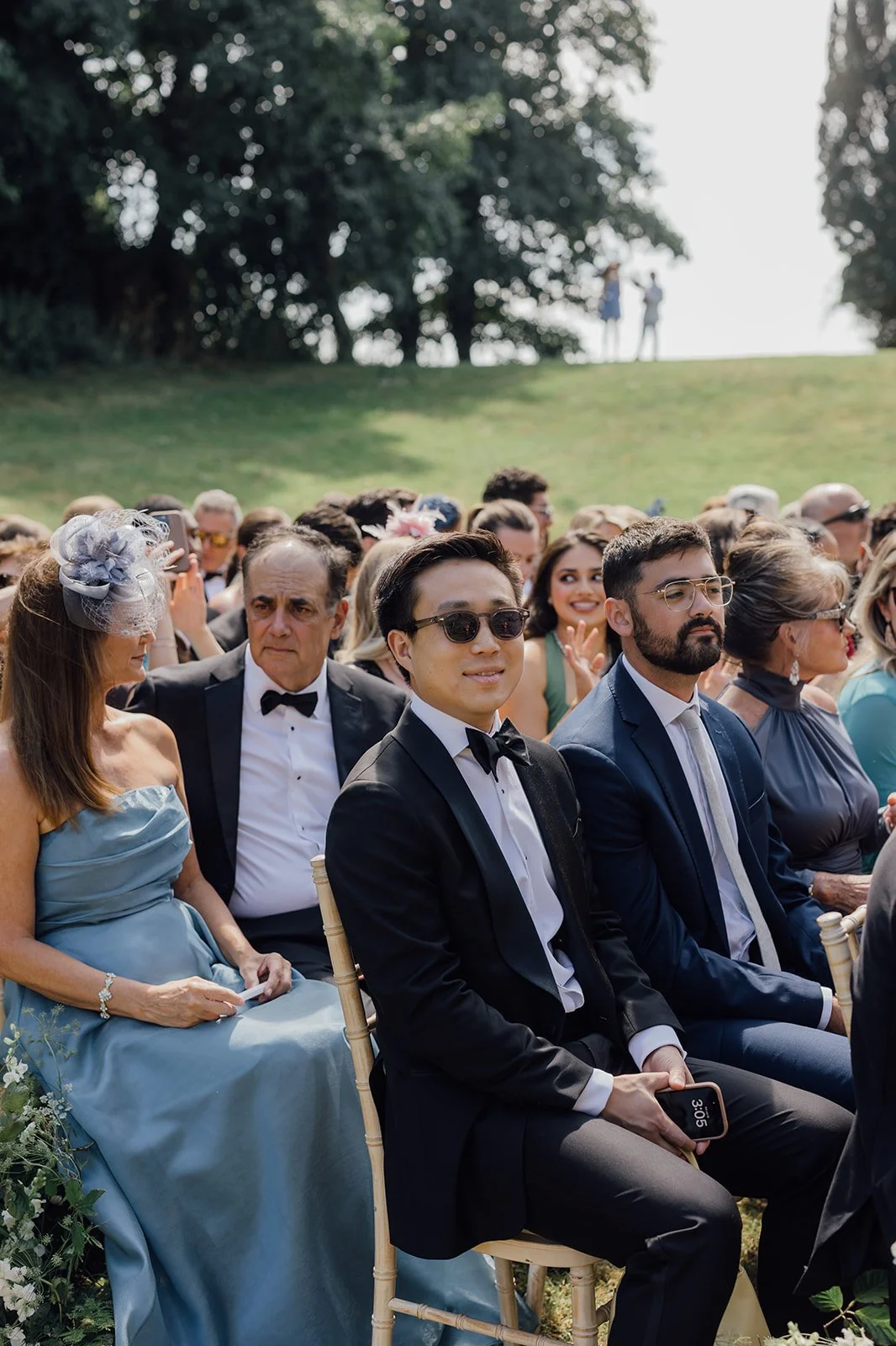 Guests sitting outside at ceremony at Castlemartyr Resort

