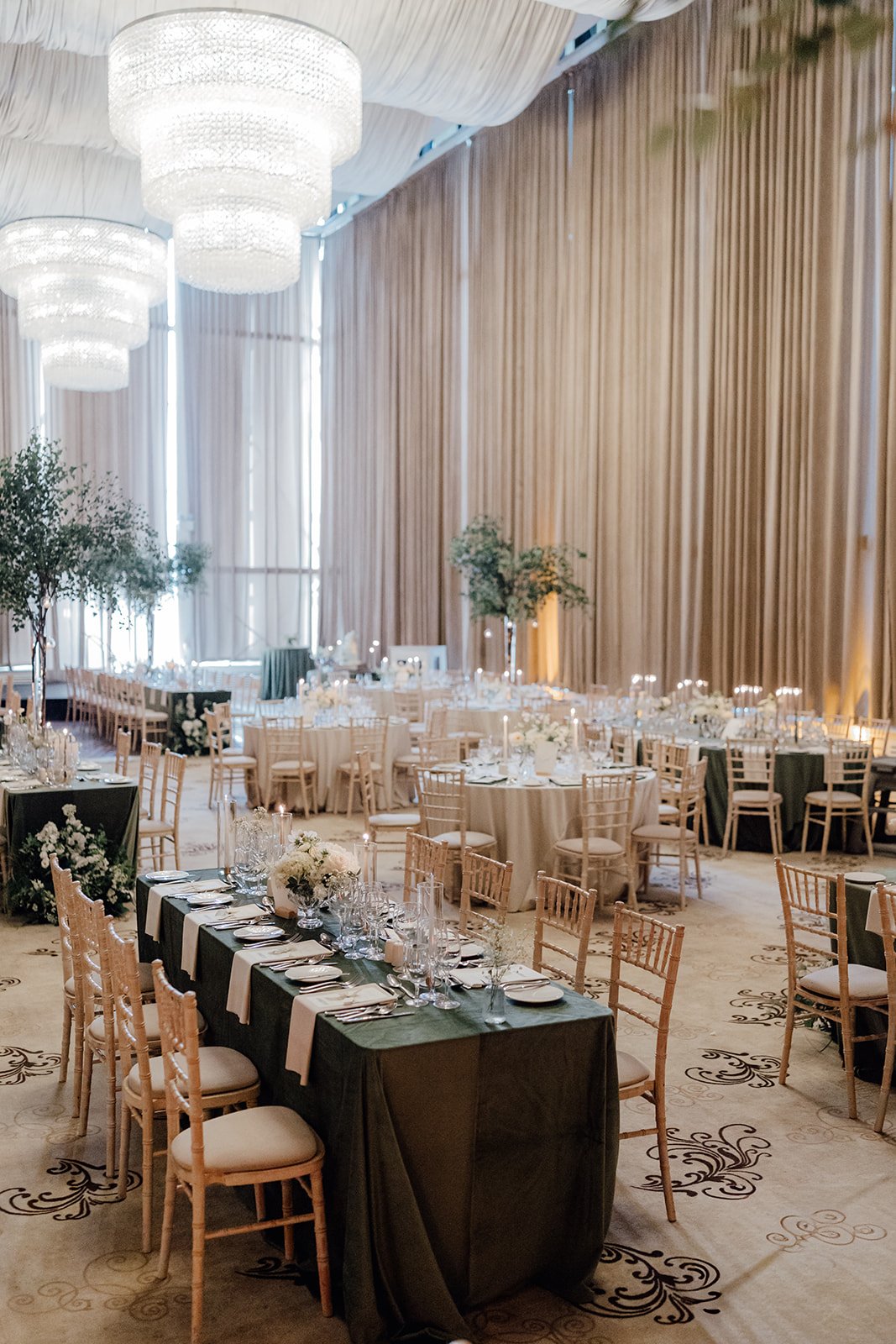 Wedding reception at Castlemartyr Resort with long green velvet tables and round ivory tables, designed by Amy Daunt Events