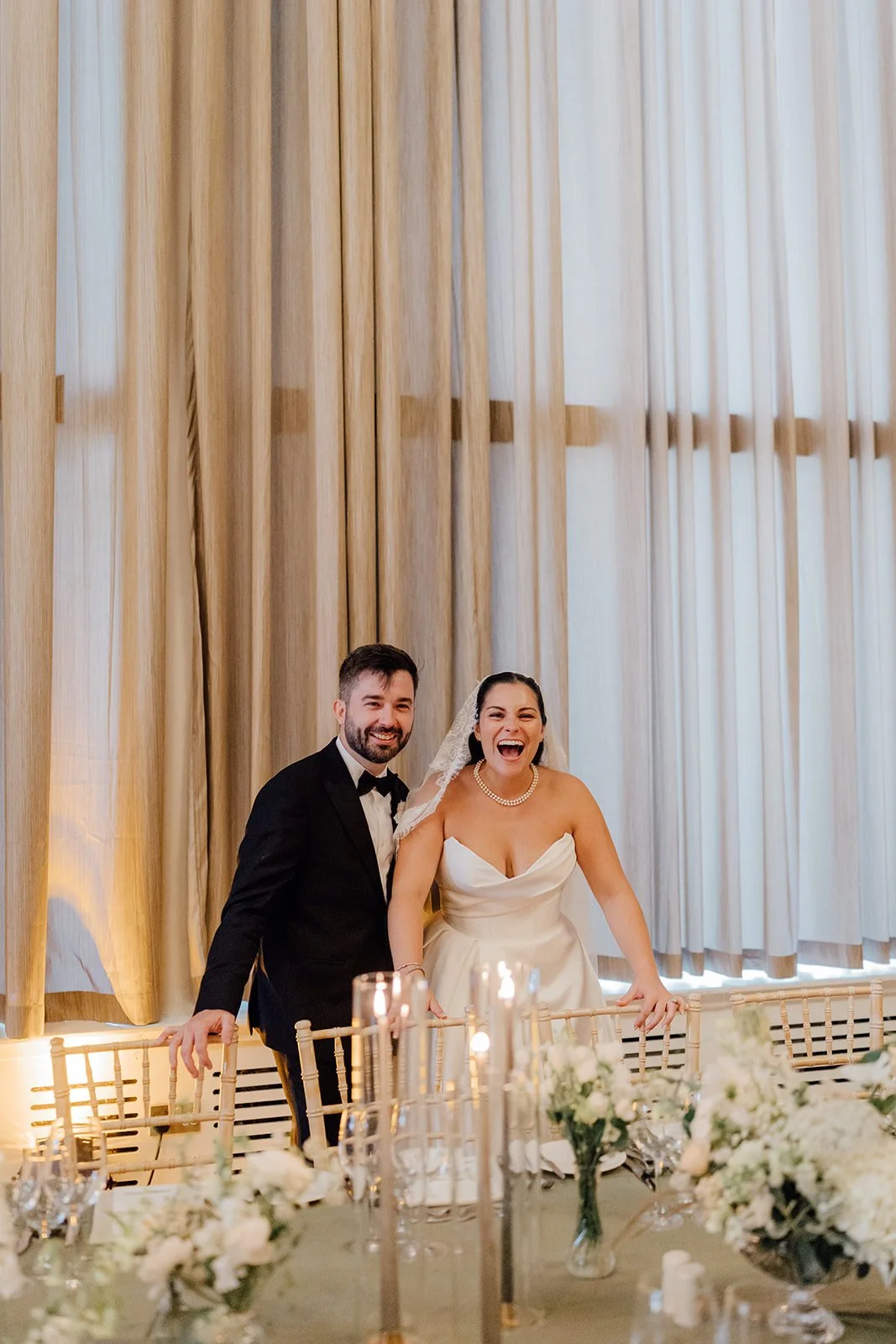 Bride and groom laughing together in their wedding reception at Castlemartyr Resort