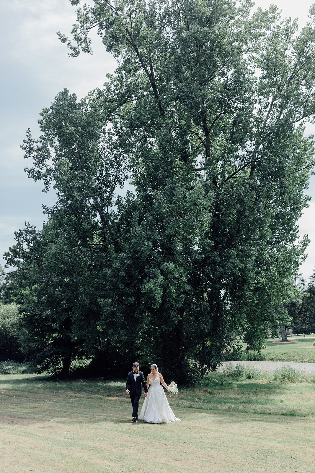 Bride and groom under the trees at Castlemartyr Resort