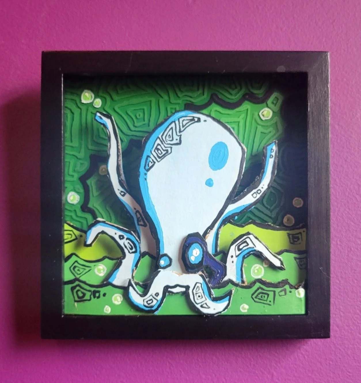  6.5”x6.5” (acrylic and cardboard on glass.) $120 "the forever cupcake" appears as a giant white octopus that lives in the sea of worldview. every so often, the forever cupcake scoots into land and gently plucks someone from the shore. the scooped pe