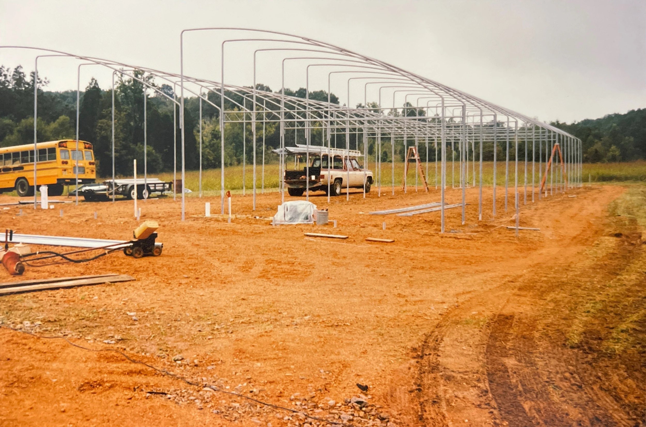 Setting foundation of greenhouses at the farm (c. 1992)