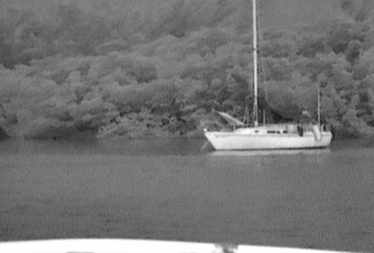 A Yacht, moored in total darkness, but with the Night Tracker, clearly visible.