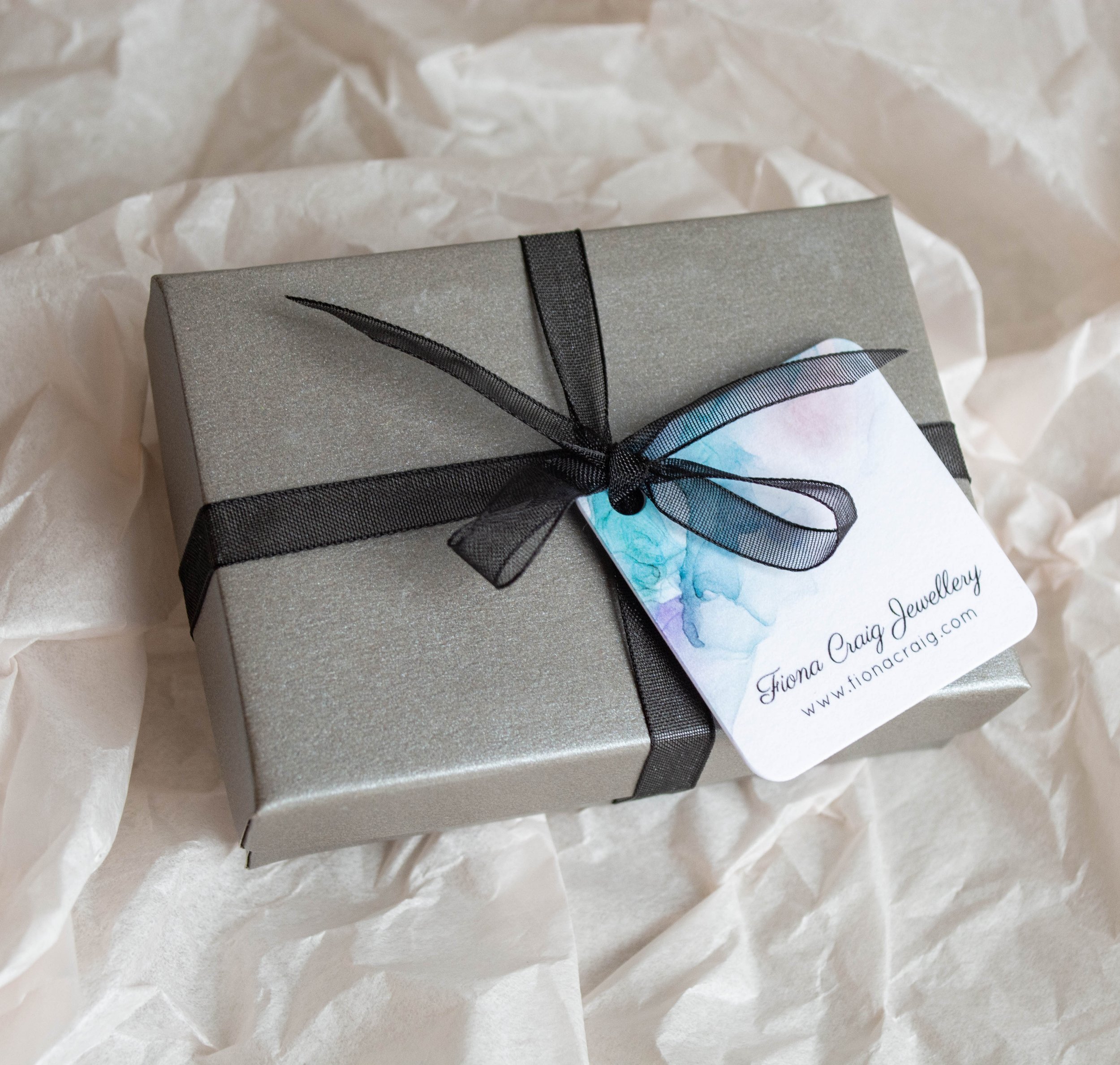A-Box-with-Black-Ribbon-for-Earrings.jpg