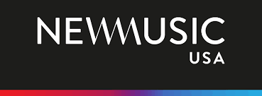 Neon sign with the text 'NEWMUSIC USA' on a black background.