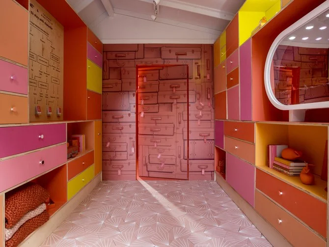 Image courtesy of Architectural Digest. The "Pantone Pantry" at Tribute Portfolio's Royal Palm hotel, host of Pantone's 2019 Colour of the Year reveal. The designated hue is "Living Coral," shown on the back wall.