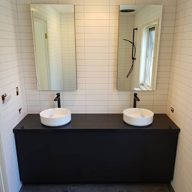 2 Matte black vanities with shaving cabinets just finished up this week.  The vertical surfaces are a Laminex product with the tops a Caesarstone 'jet black'. To achieve the handle less look, Blum movento tipons were used.