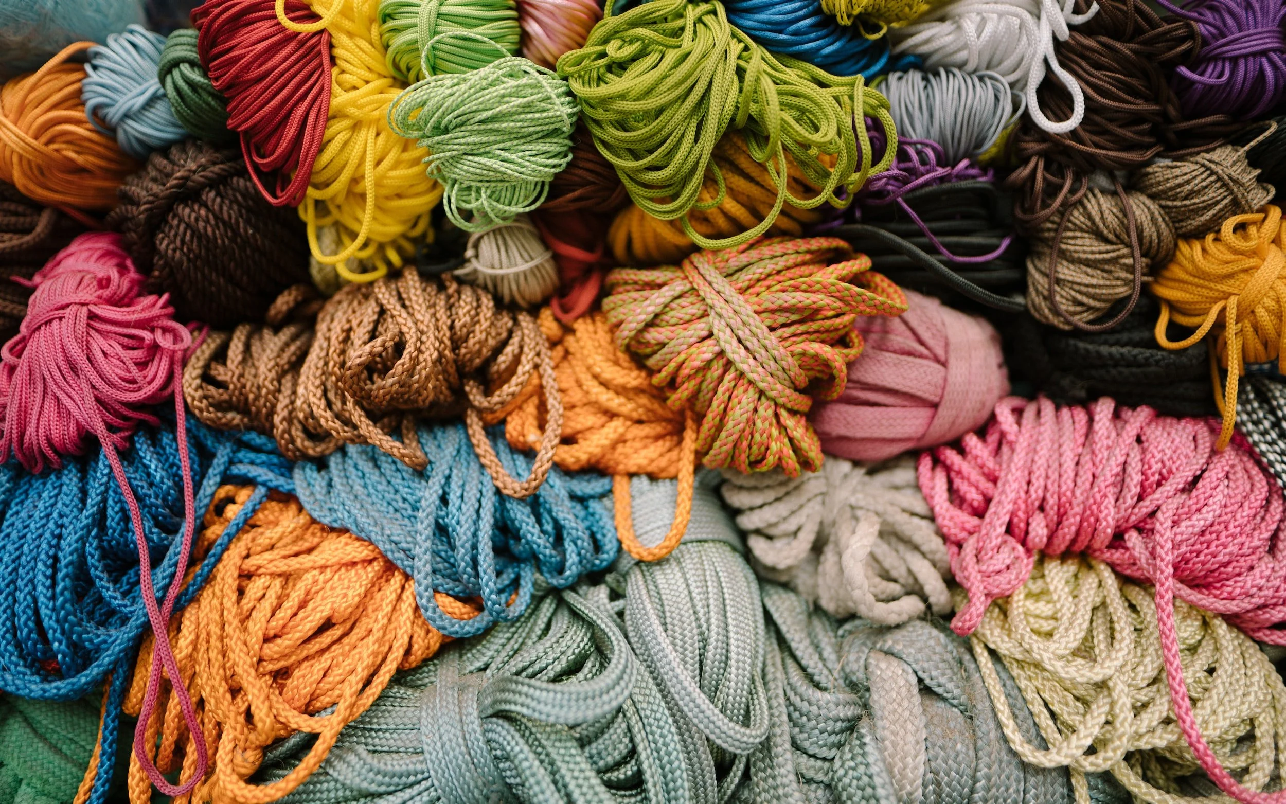a pile of climbing ropes of all different colours