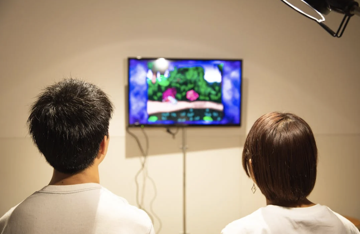 A man and a woman gaming online