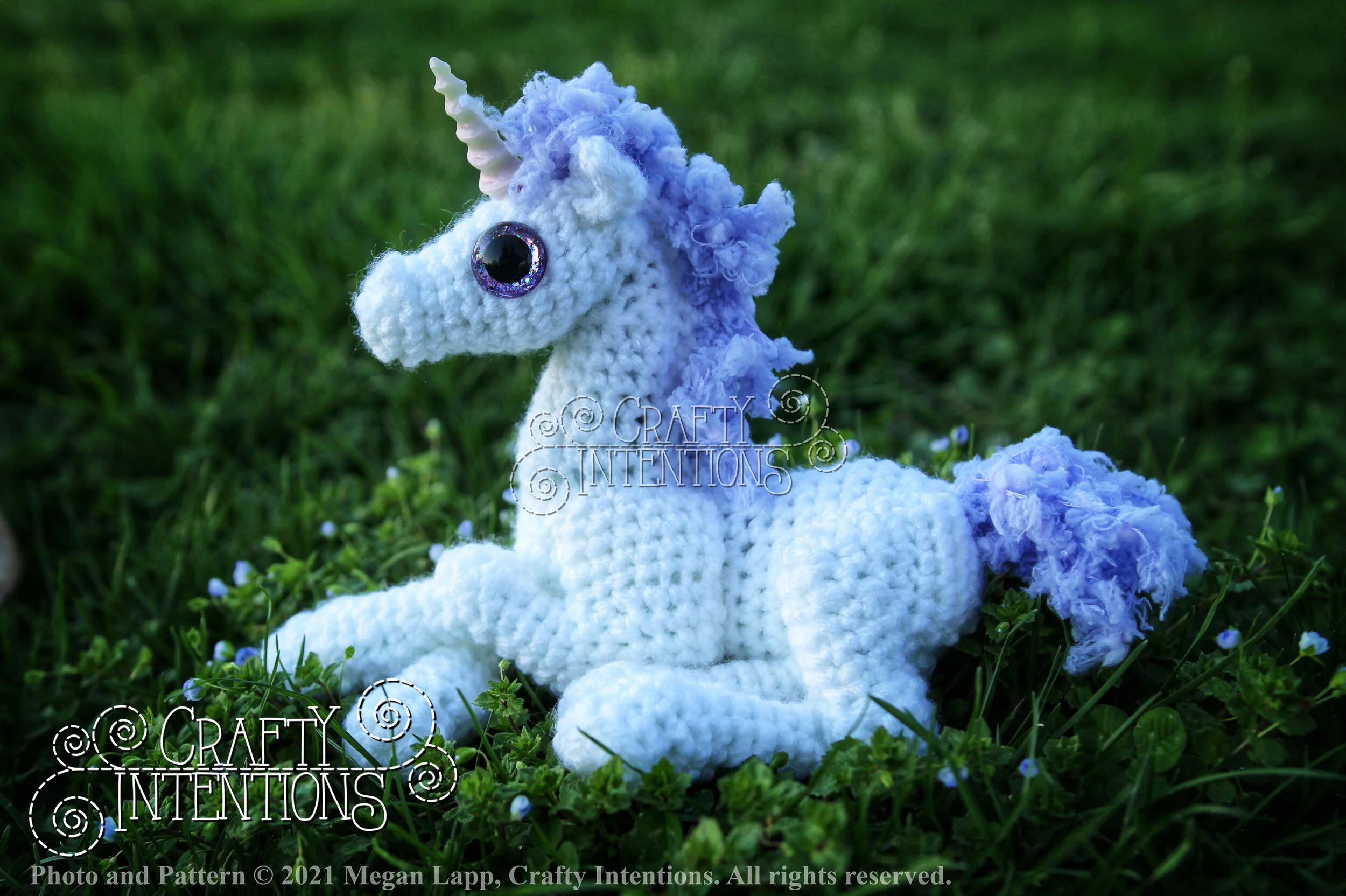 IMG_4361-01 Laying Down Baby Unicorn with Lilac Horn and Lilac Tail with Logo and Copyright.jpg
