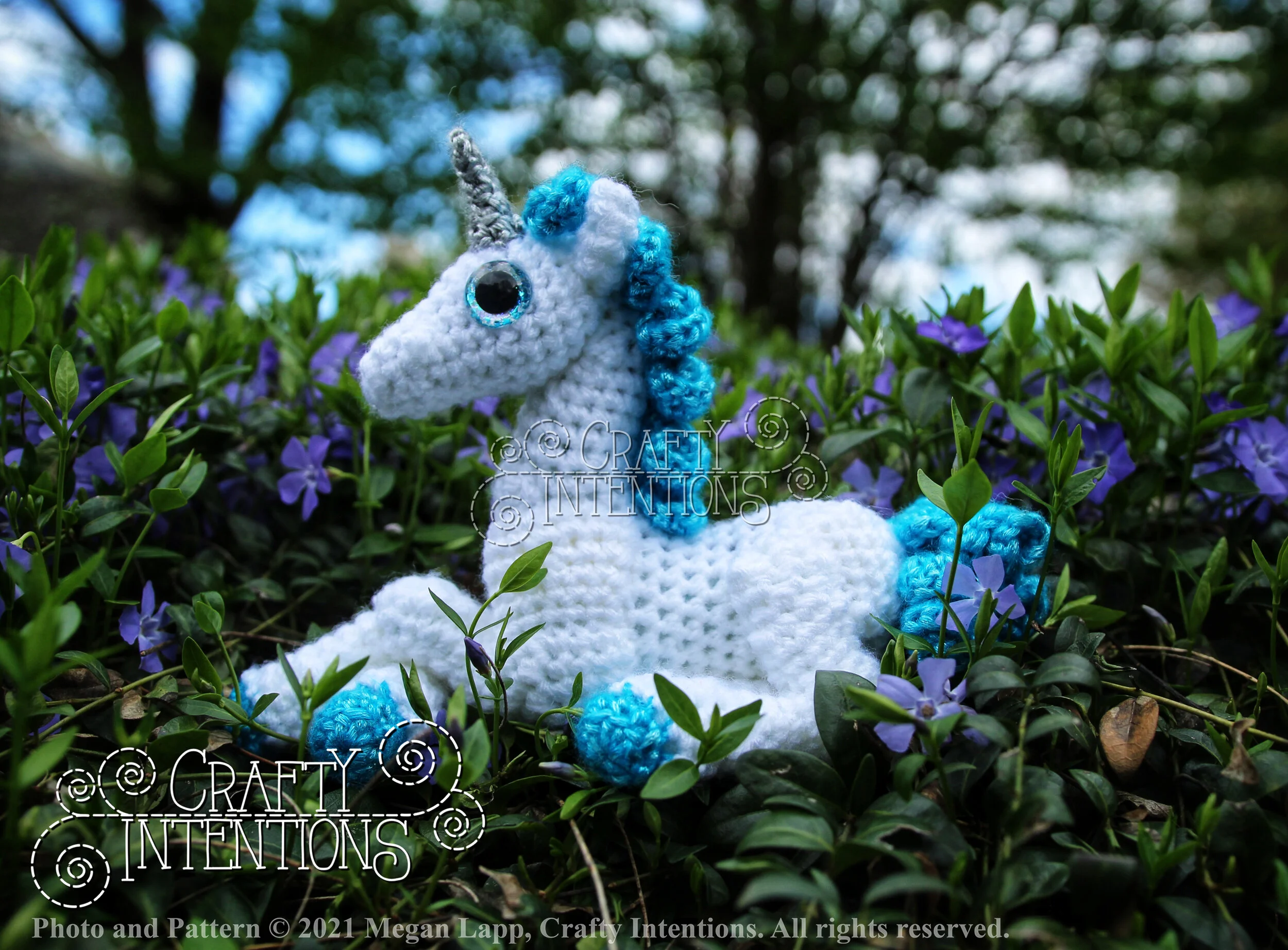 IMG_4583-01 Laying Down Baby Unicorn with Silver Horn and Blue Tail with Logo and Copyright.jpg