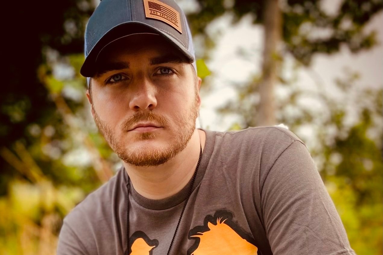 TRAVIS REIGH