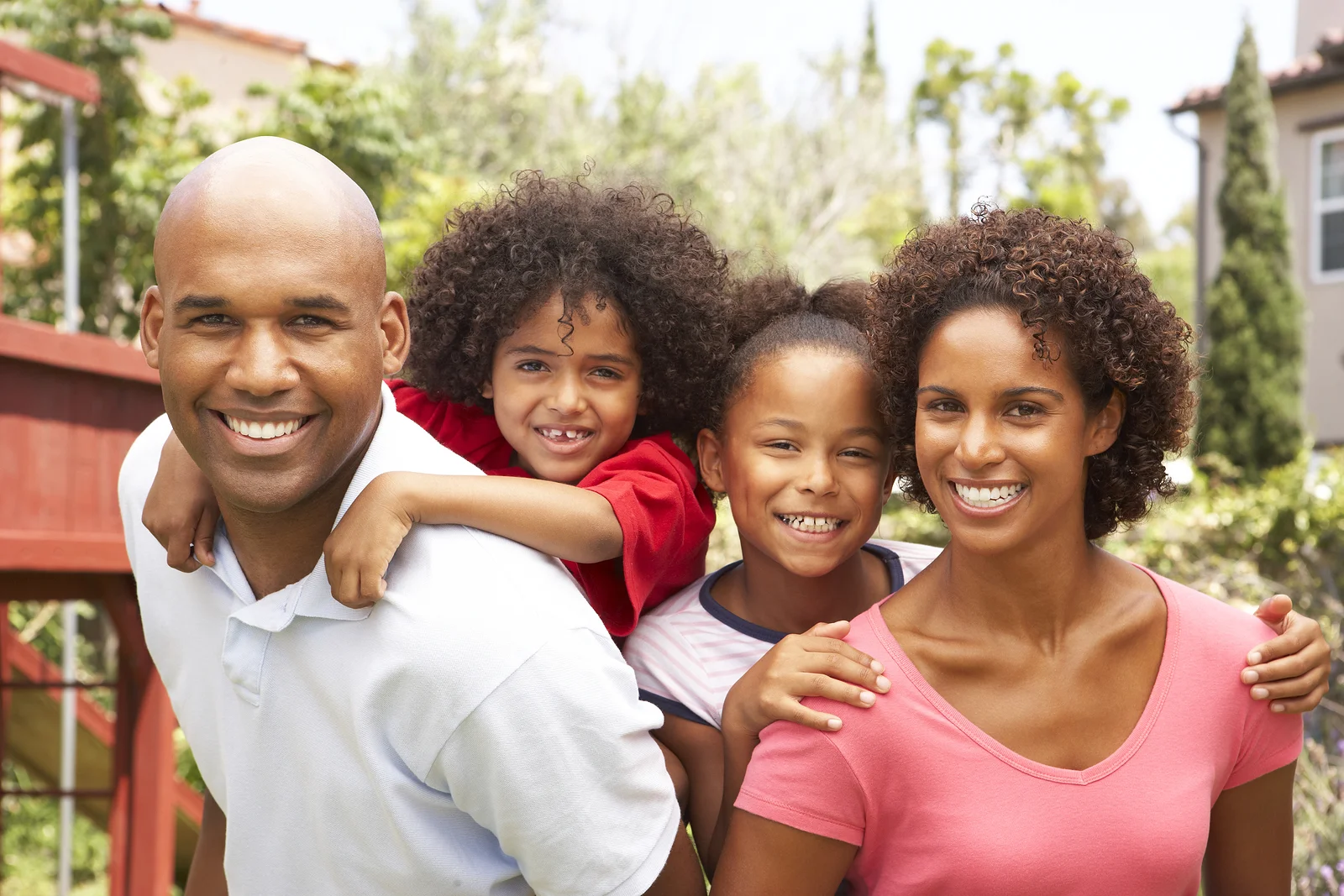 bigstock-Portrait-of-Happy-Family-In-Ga-13907699.jpg