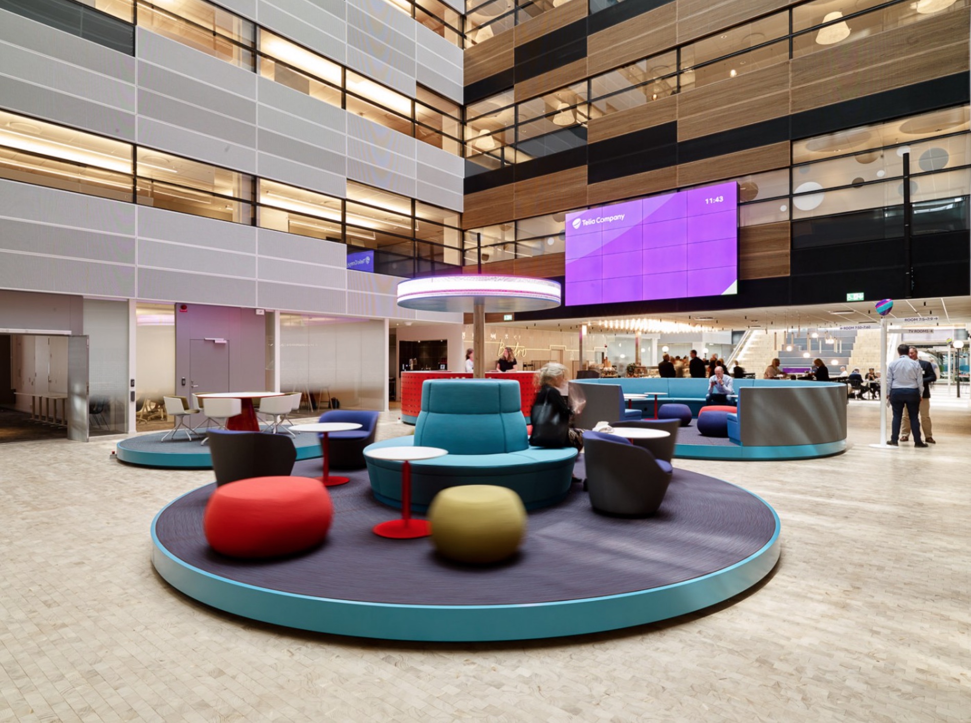 The first atrium (‘On the go’) is about movement and offers seating areas on slowly rotating platforms and a LED display with moving messages such as internal information, news or weather info… Photo by Per Ranung