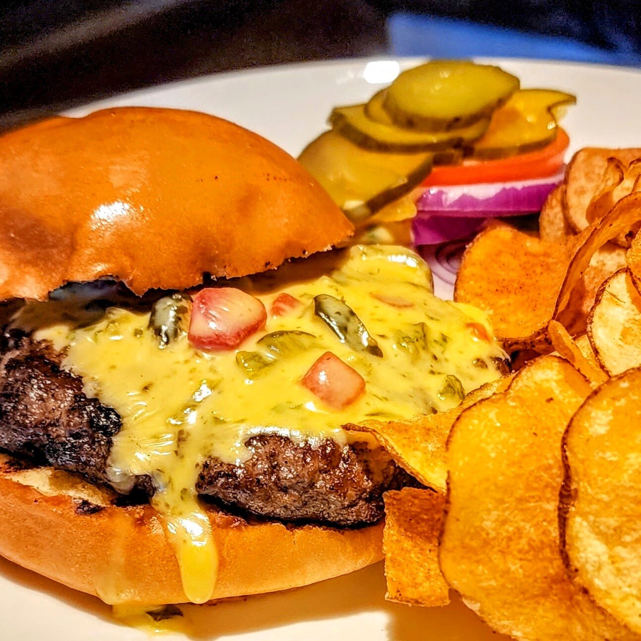 Everyone loves chili con queso! So this Friday's #wildgame burger features Chef's magic cheese sauce. #BurgerFriday just got a whole lot tastier! rainbow-lodge.com