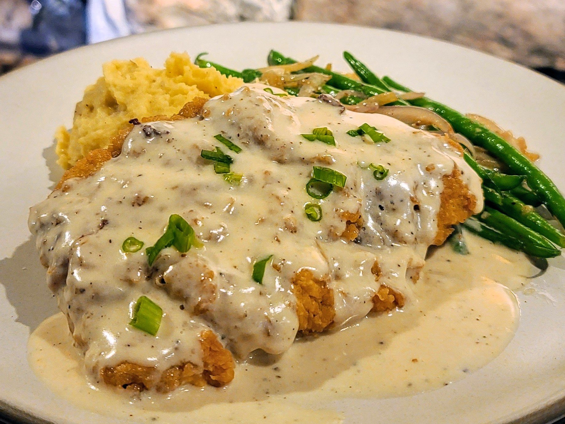 Your patience will be rewarded. First Sunday means chicken-fried steak for #Sundaysupper! Served with French beans and buttery mashed potatoes, still only $15, this Sunday after 4:00. Book your table or order to-go at rainbow-lodge.com.