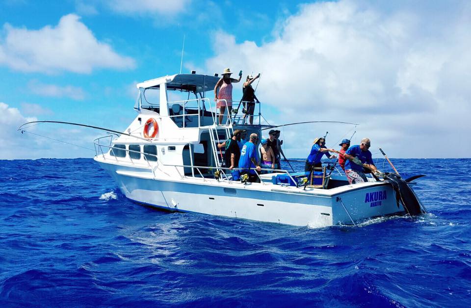 pulling the 150kg blue marlin on board.jpg