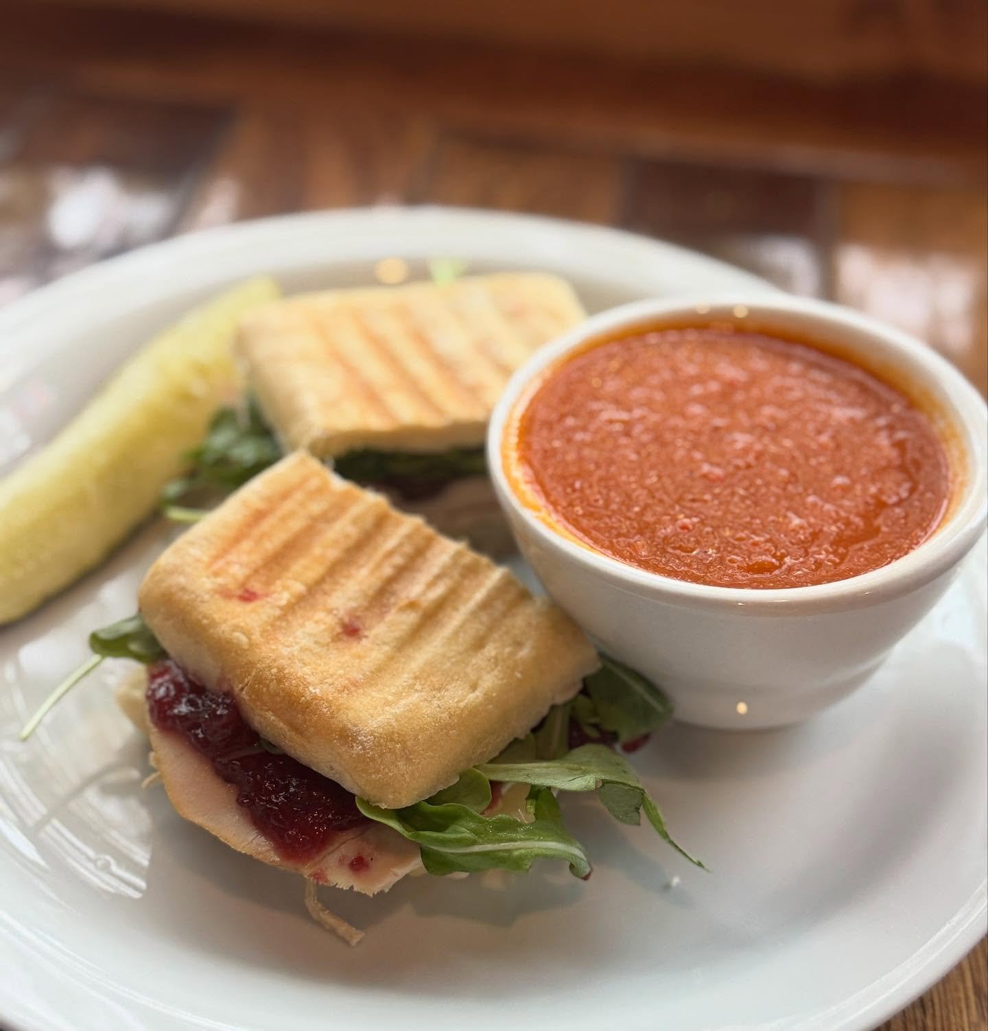 New November specials now at The Common Cup! Pictured: our Turkey Gobbler 🦃 Turkey sandwich with Brie cheese, arugula, and cranberry sauce toasted in a hoagie roll.