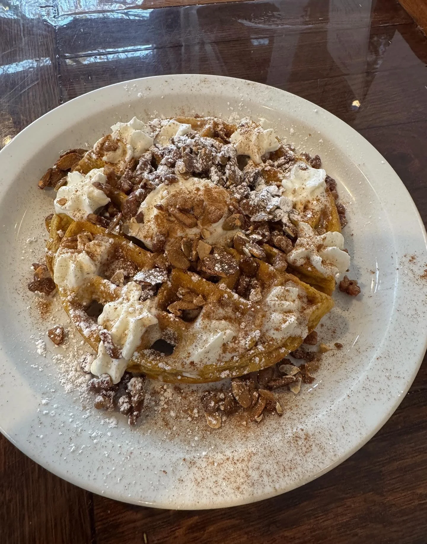 Come try our Pumpkin Pie waffle! Spiced pumpkin waffle with cream cheese glaze, whip cream, candied pecans and pumpkin seeds!