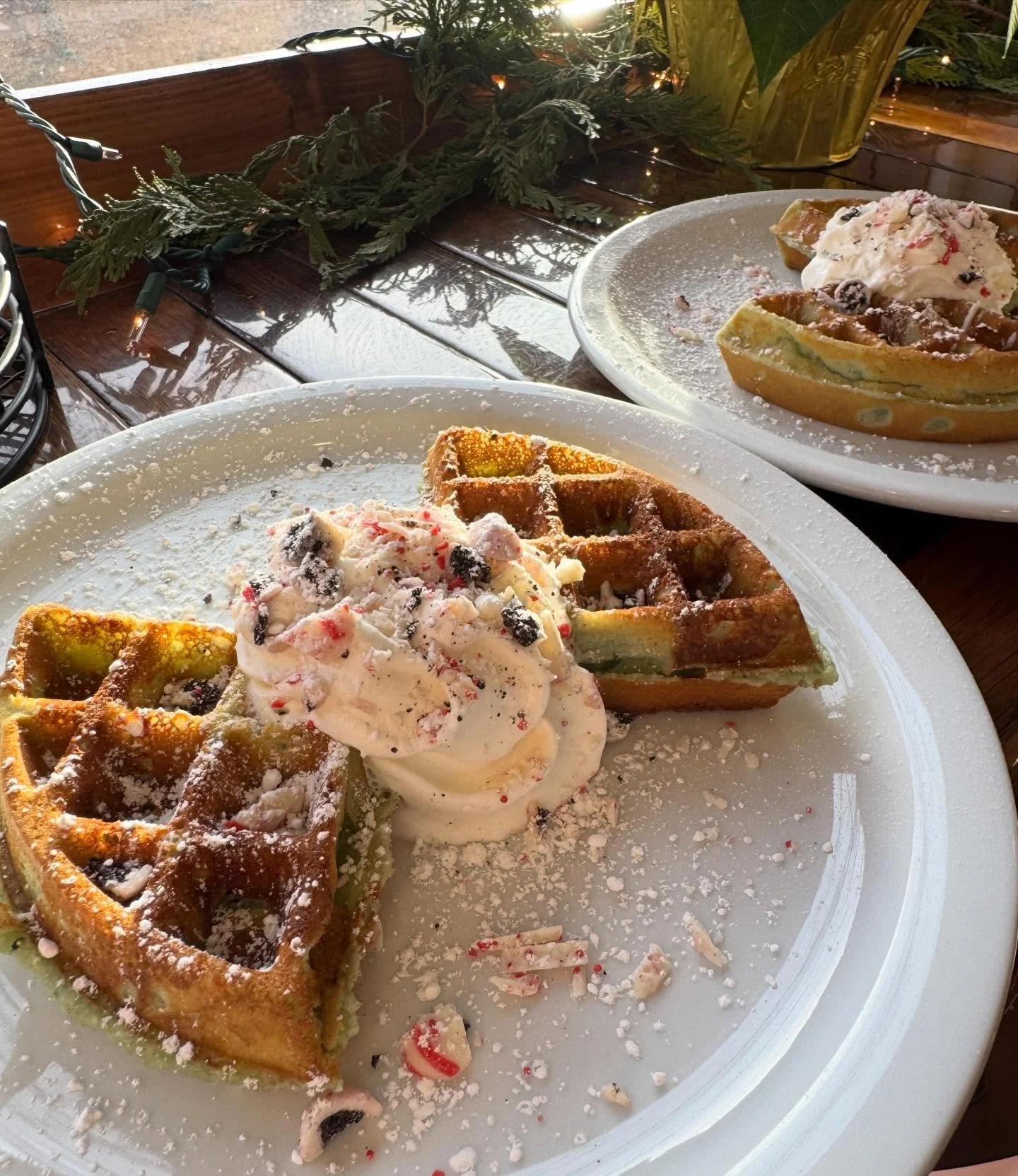 THE GRINCH is back! 🎄and stealing the show at The Common Cup. A delicious sweet green Pandan waffle topped with whip cream and white chocolate peppermint bark cookie crumbles.