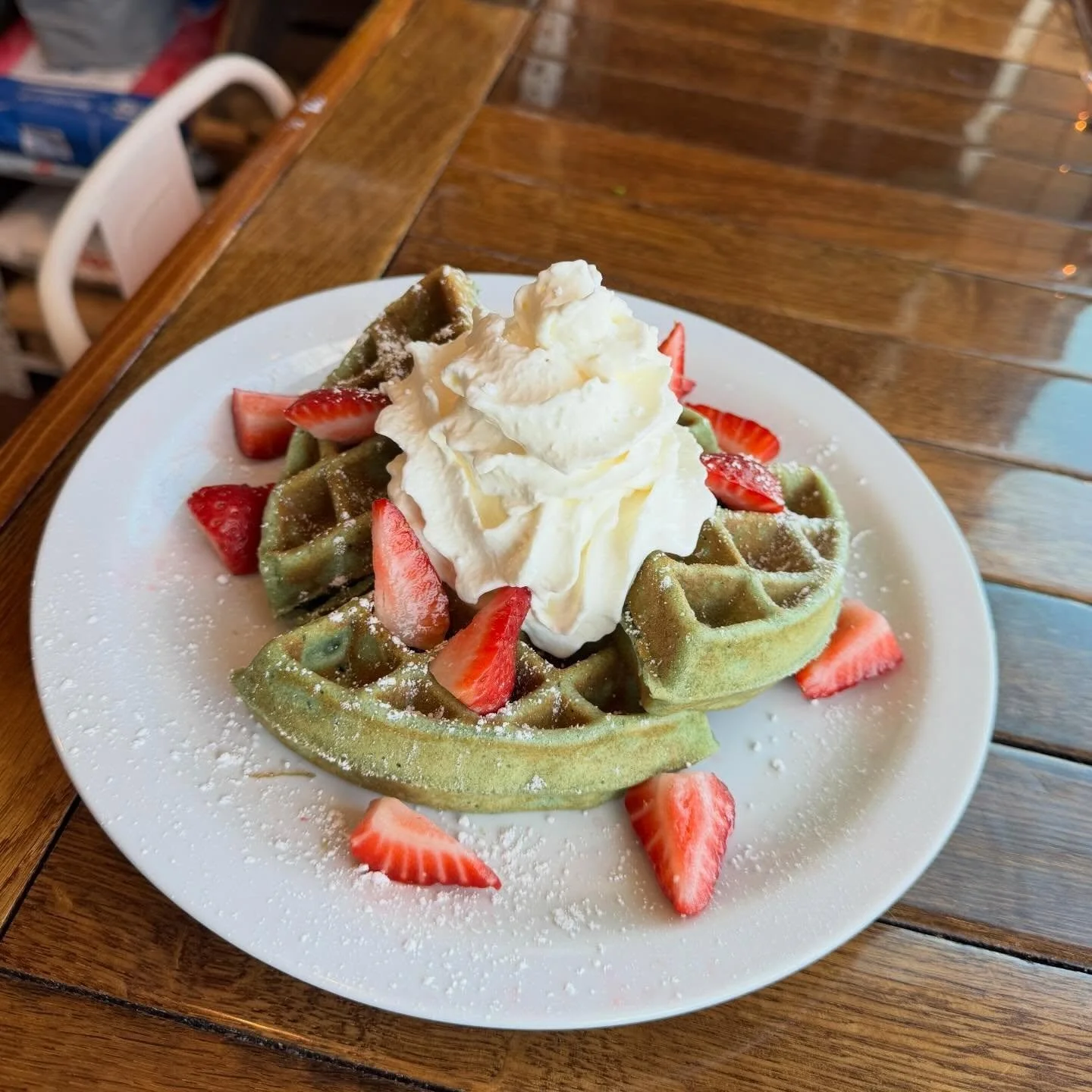 🍀 Shamrock Waffle 🍀 Our March seasonal - a festive white chocolate chip waffle with fresh strawberries, whip cream and powdered sugar