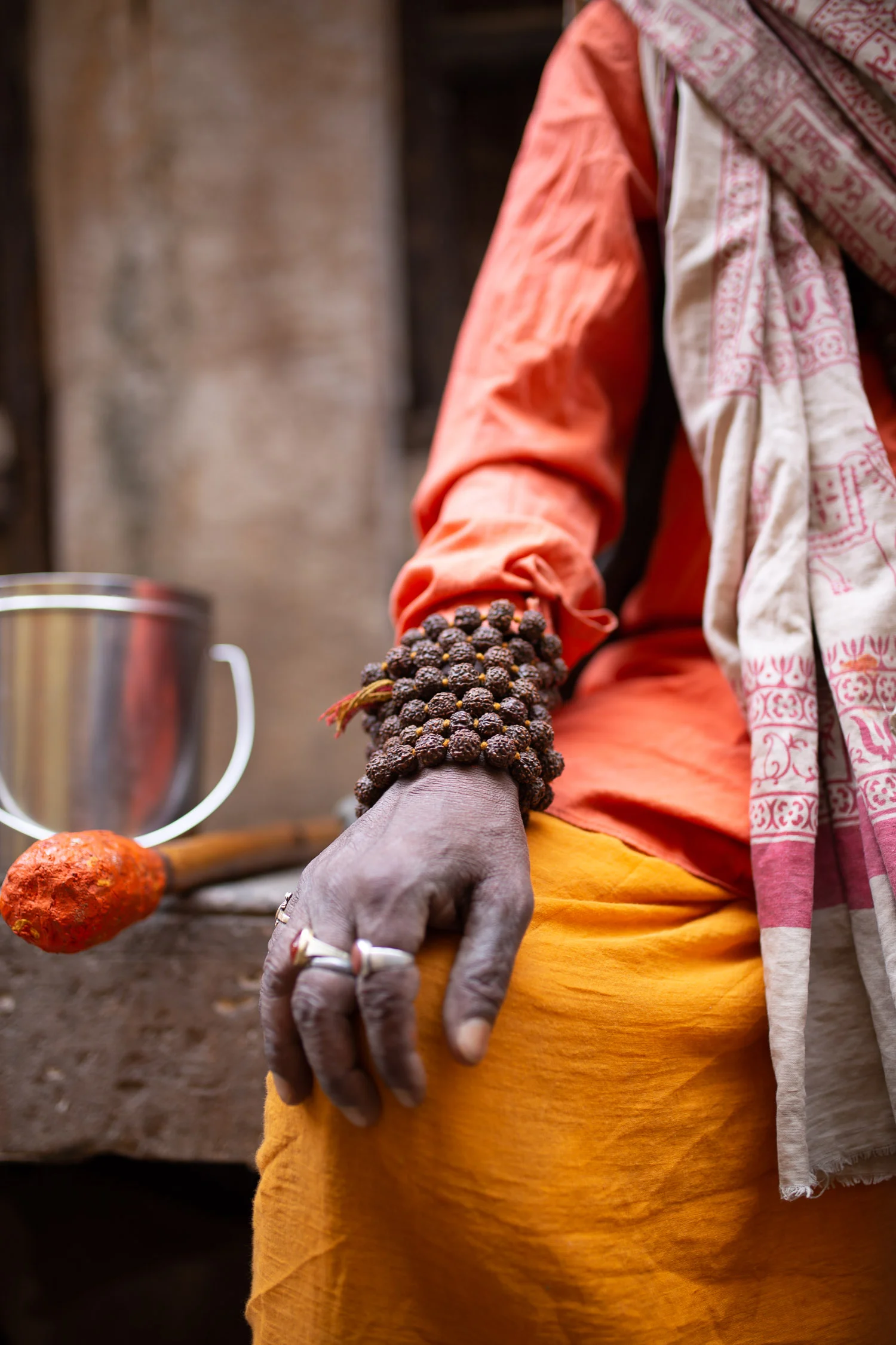 Indian-holy-man-hand-detail-with Khrisha-tears-bracelet.jpg