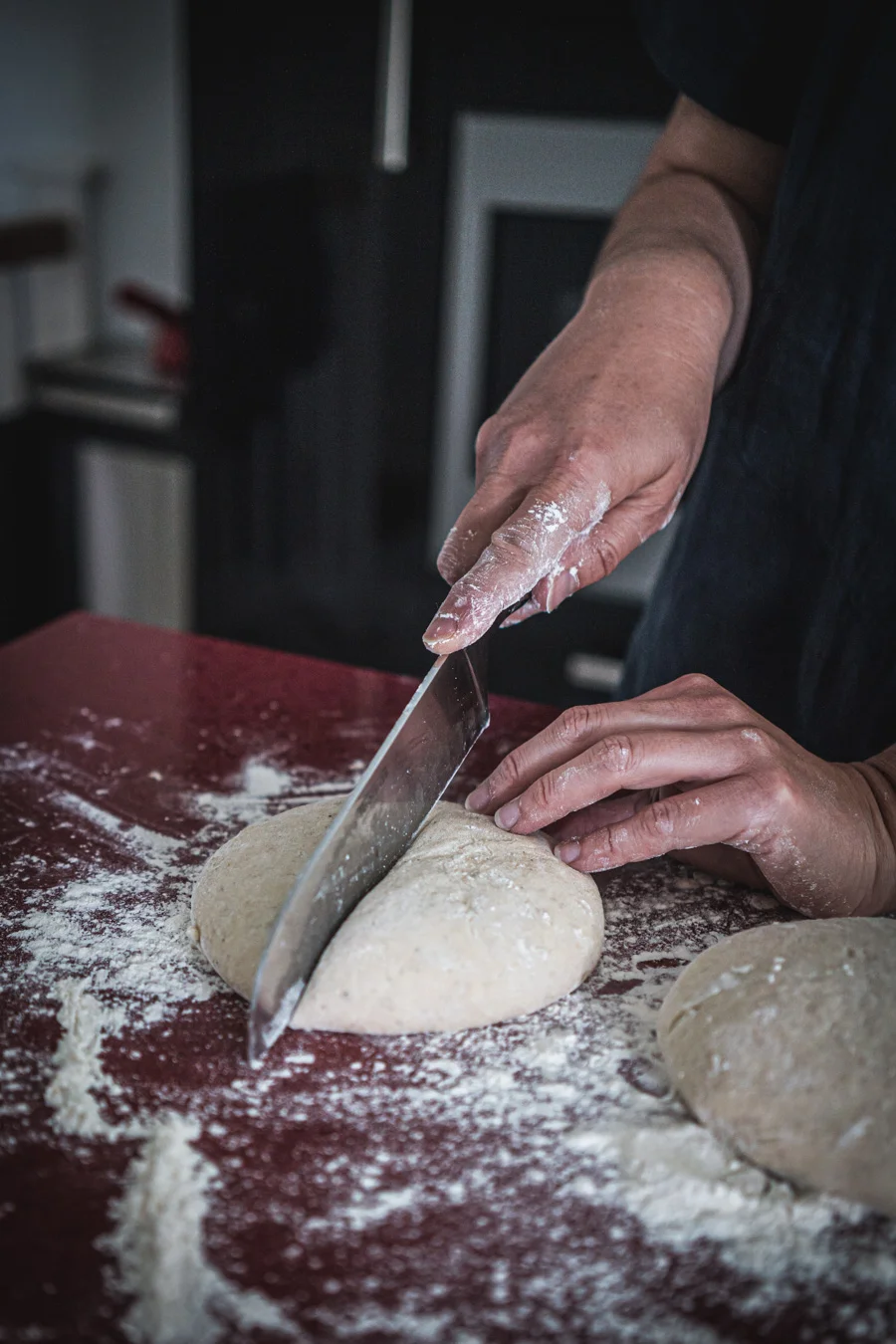 Mahamri - Mandazi-splitting.jpg