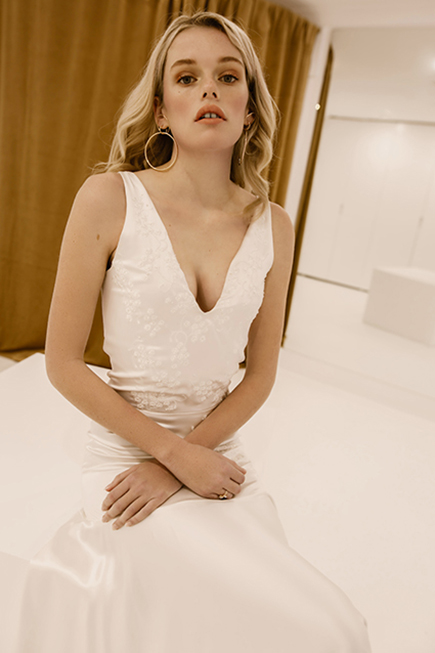 With a tight fit and modern silhoutte, our 'Piece 9' wedding dress is sure to make you swoon. Discover L'eto's take on the contemporary, artful bride. View now.