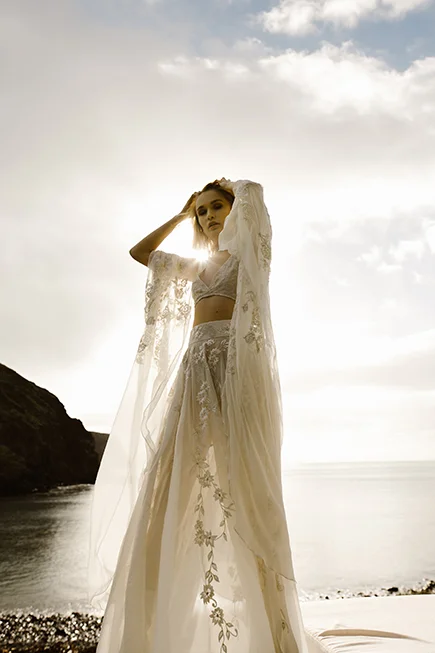 model wearing our coachella bridal set into the sun set 