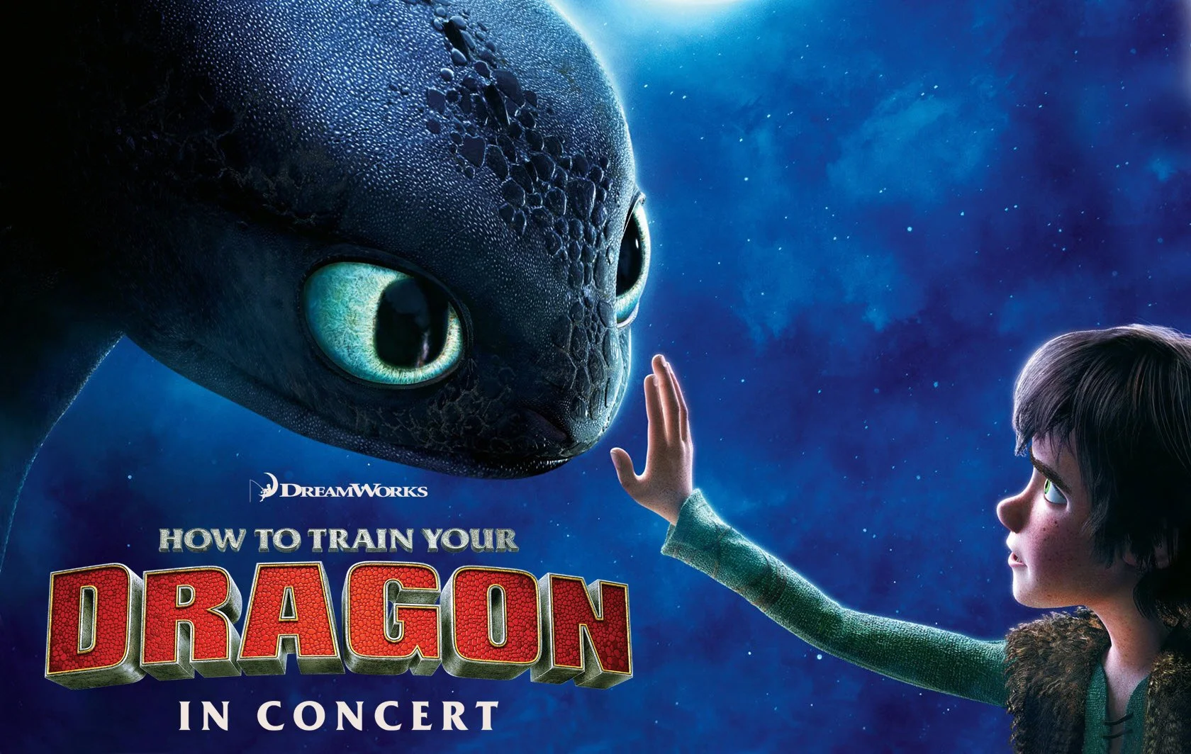 boy reaching out to touch a dragon