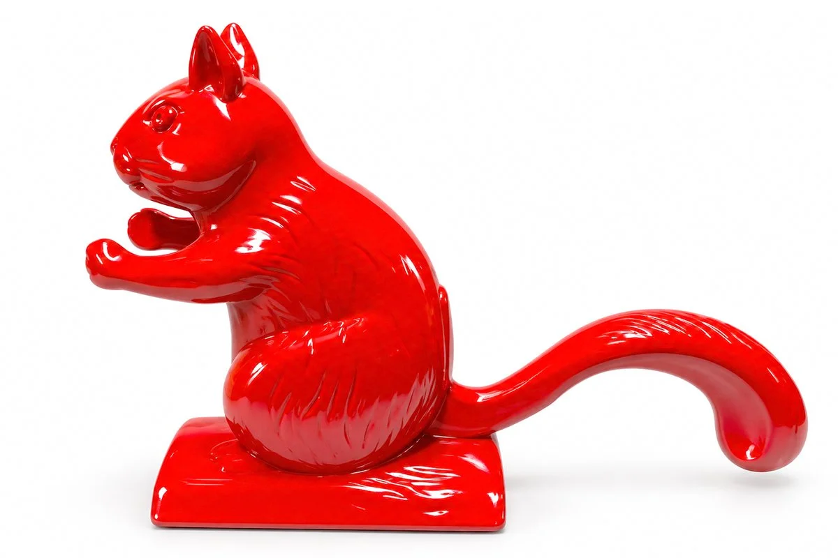 Side view of The Ditters Squirrel Nutcracker showing its cast metal body, tail lever and nut-cracking mechanism.