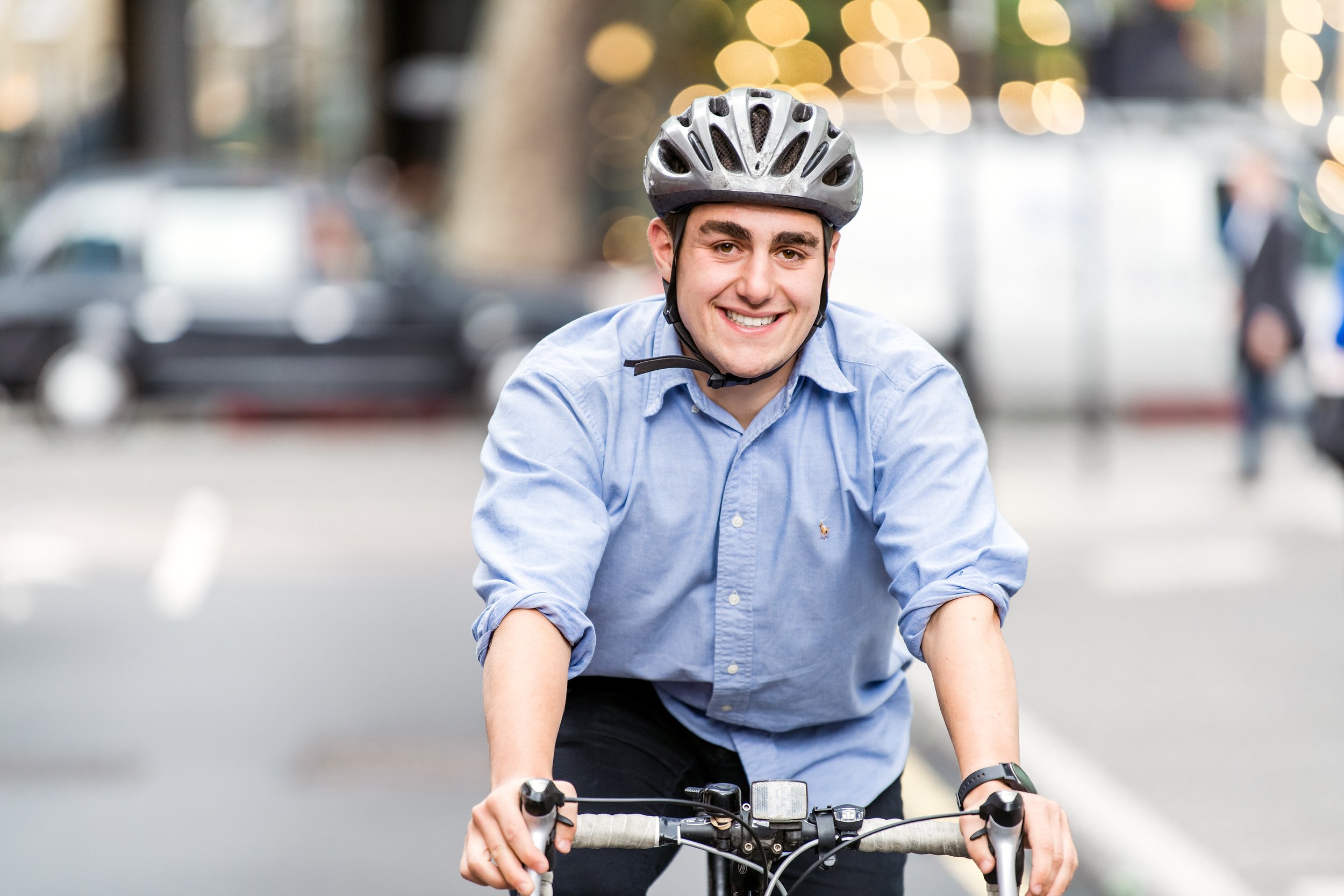  Man with helmet riding on his bike to work. 