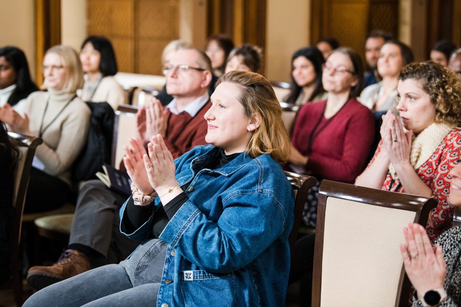 Audience clapping at conference