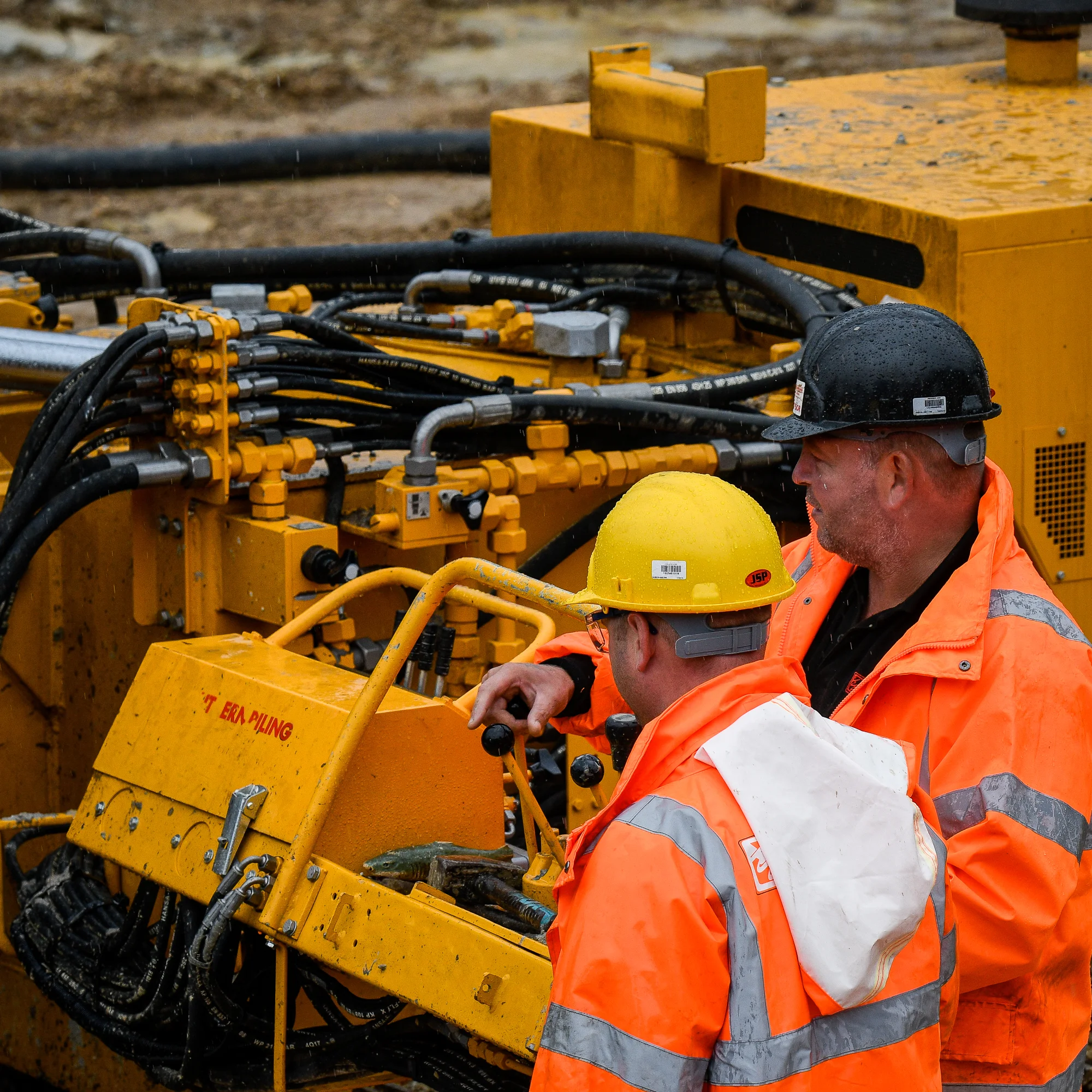 Construction site workers and machinery