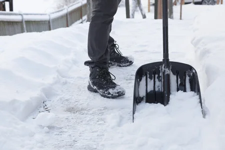 50917434_S_shoveling_snow_boots_man_winter.jpg