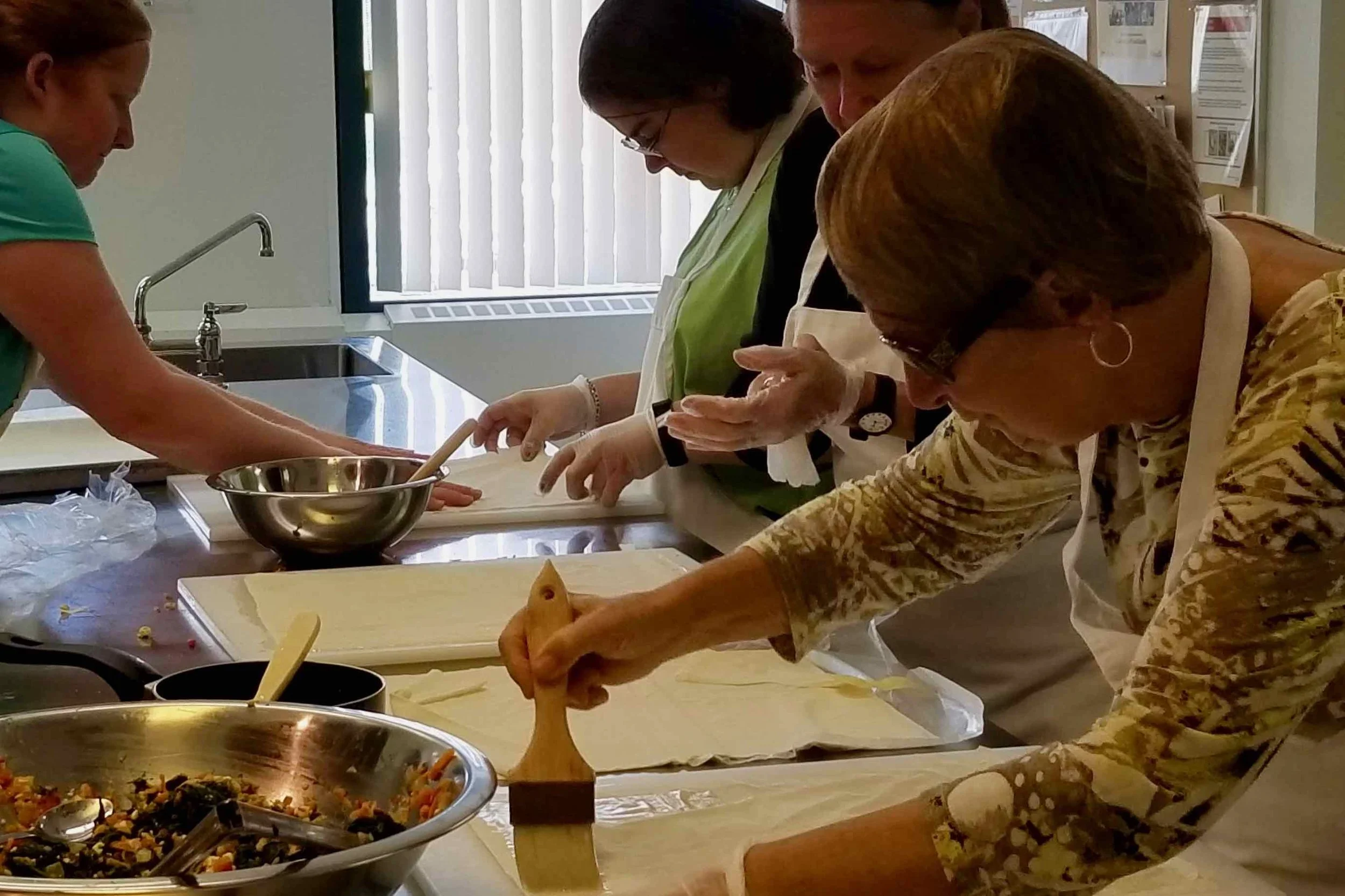 CCB member Deb making spanakopita with Active Together