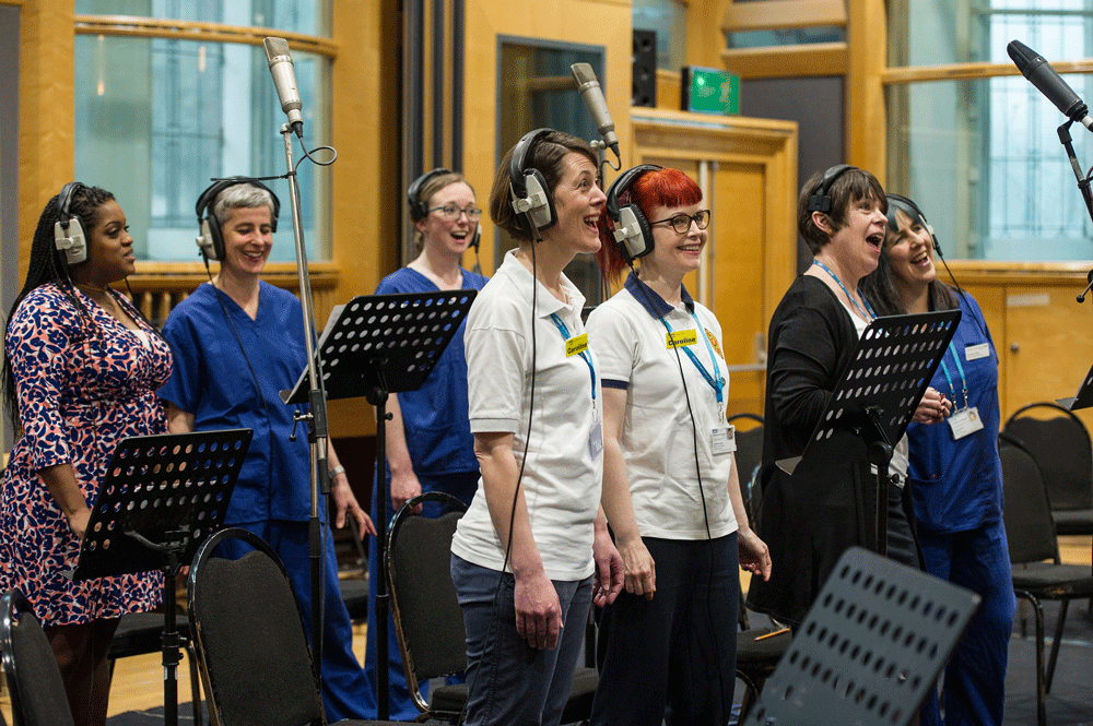 Members of the choir in the studio.png
