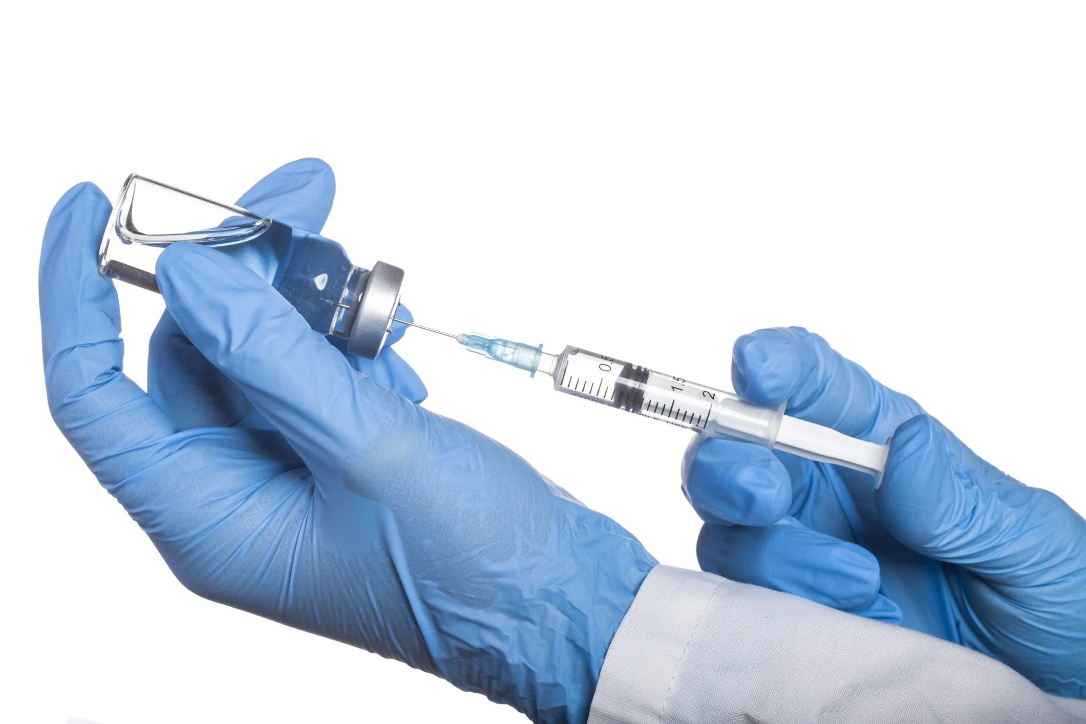 lab technician's gloved hands withdrawing hyaluronic acid from a bottle of hyaluronic acid