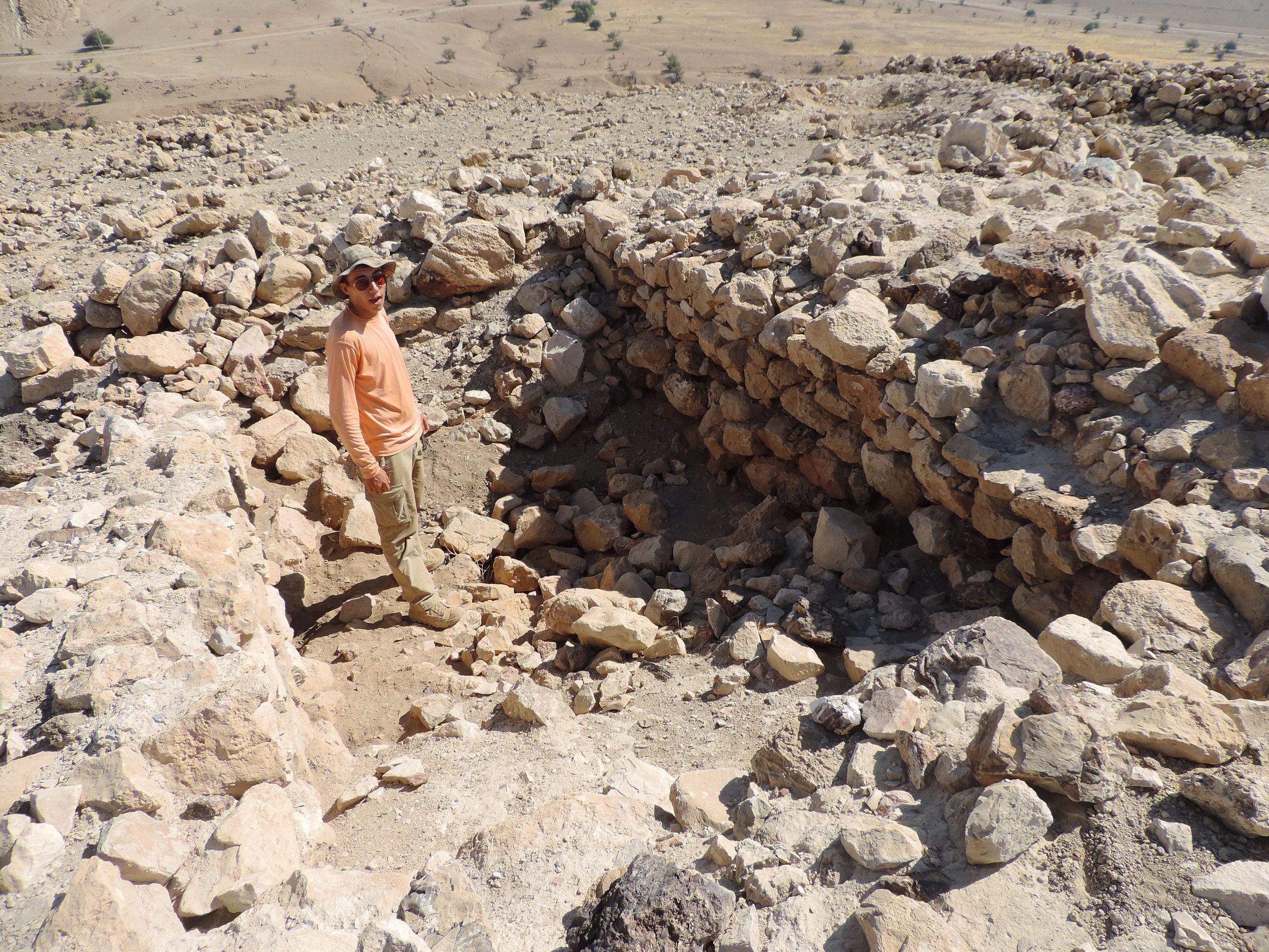 (9) Student Standing inside Remains of a Large Structure at Kh. Auja el-Foqa.jpg