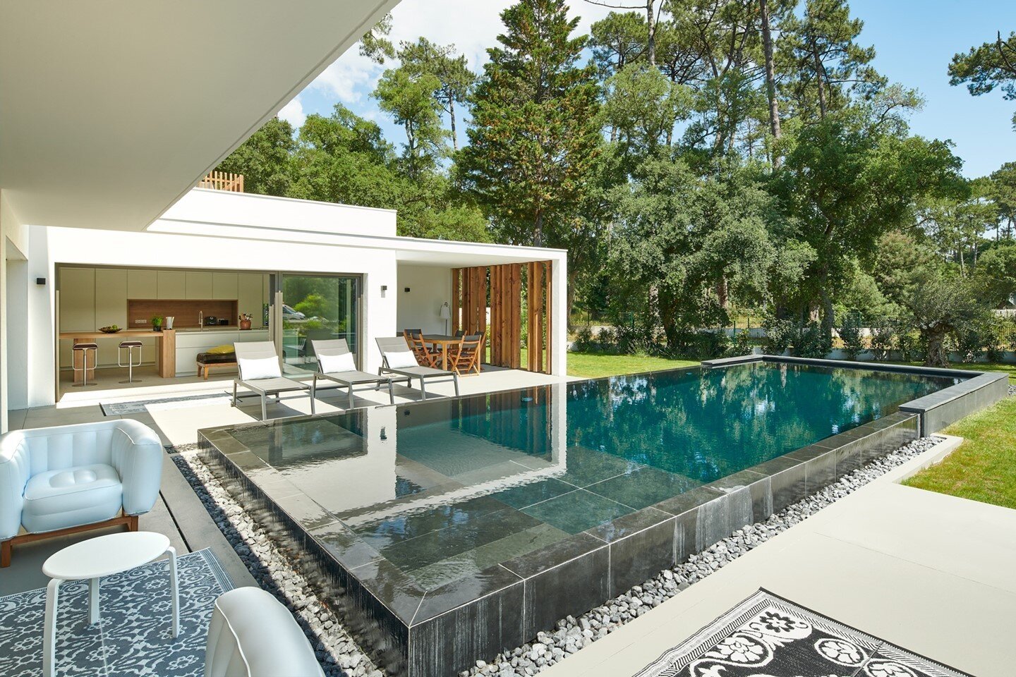 ⁠The pool is without a doubt a highlight of the home. It is sculptural in its presence and it&rsquo;s easy to imagine many beautiful summer days with this as your backdrop. The huge windows invite even more enjoyment into the home as the walls fall a