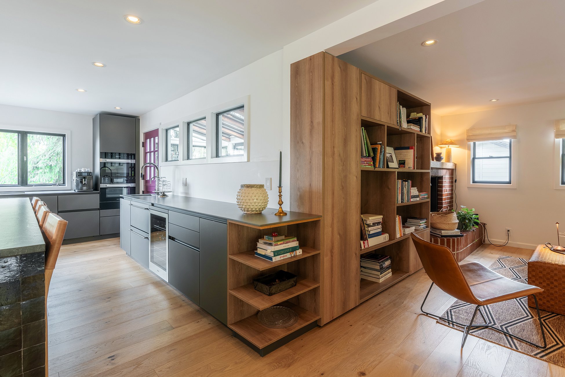 Kitchen comparison showcasing both frameless cabinets and open shelving in a spacious kitchen with warm and cool tones.