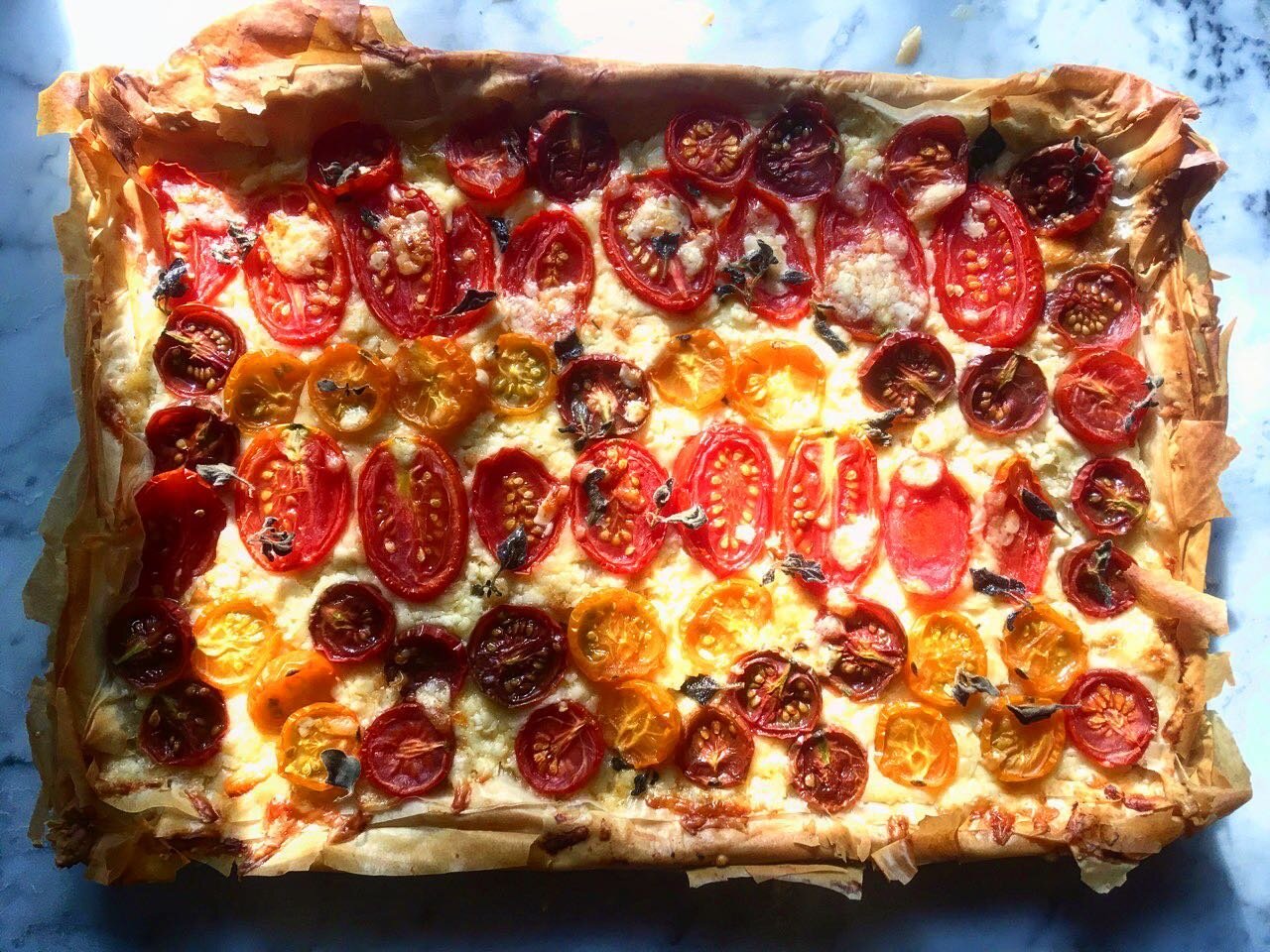 Tomato Cheddar Phyllo Tart 

Grab a glass of wine. It&rsquo;s Friday. This 5 ingredient show stopper is perfect now with cherry tomatoes in season. Recipe link in bio. #ediblekitchen