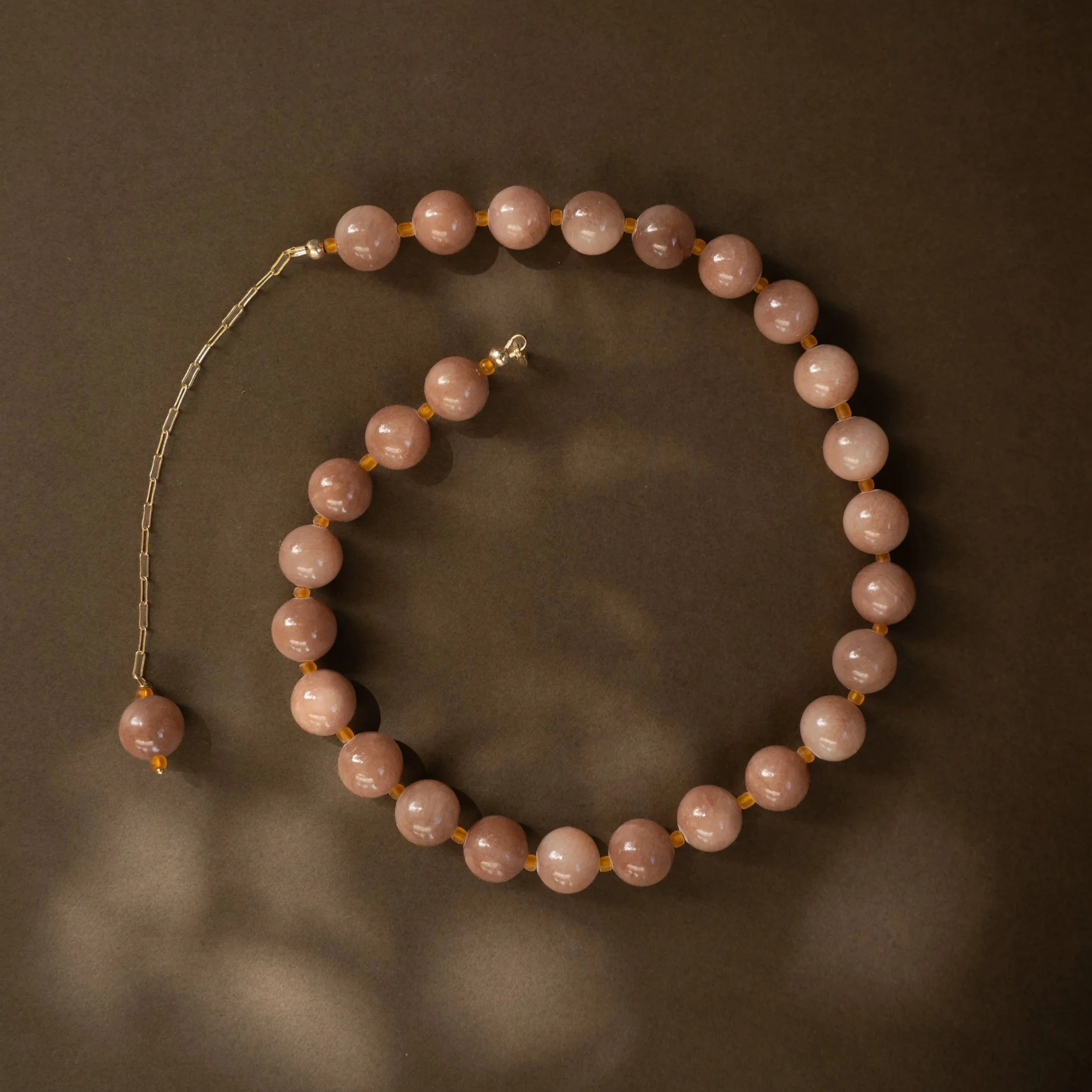 Sunstone Necklace. Large, glossy pink sunstone gemstone beads spaced with citrine. Finished with 14ct gold filled findings. Ochre Jewellery, handmade Byron Bay.
