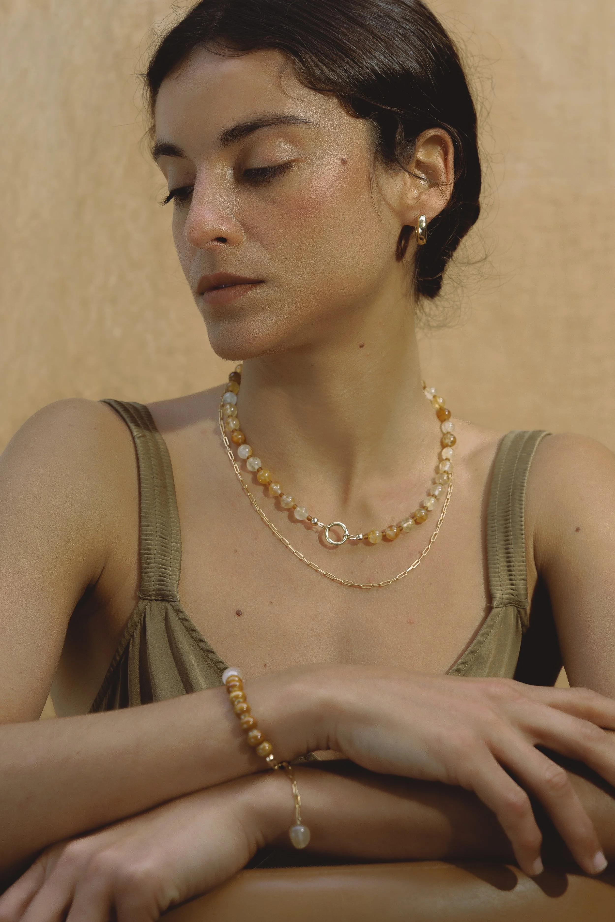 Citrine Necklace. Round faceted citrine gemstone beads with a personalised charm clasp. Finished with 14ct gold filled findings. Ochre Jewellery, handmade Byron Bay.