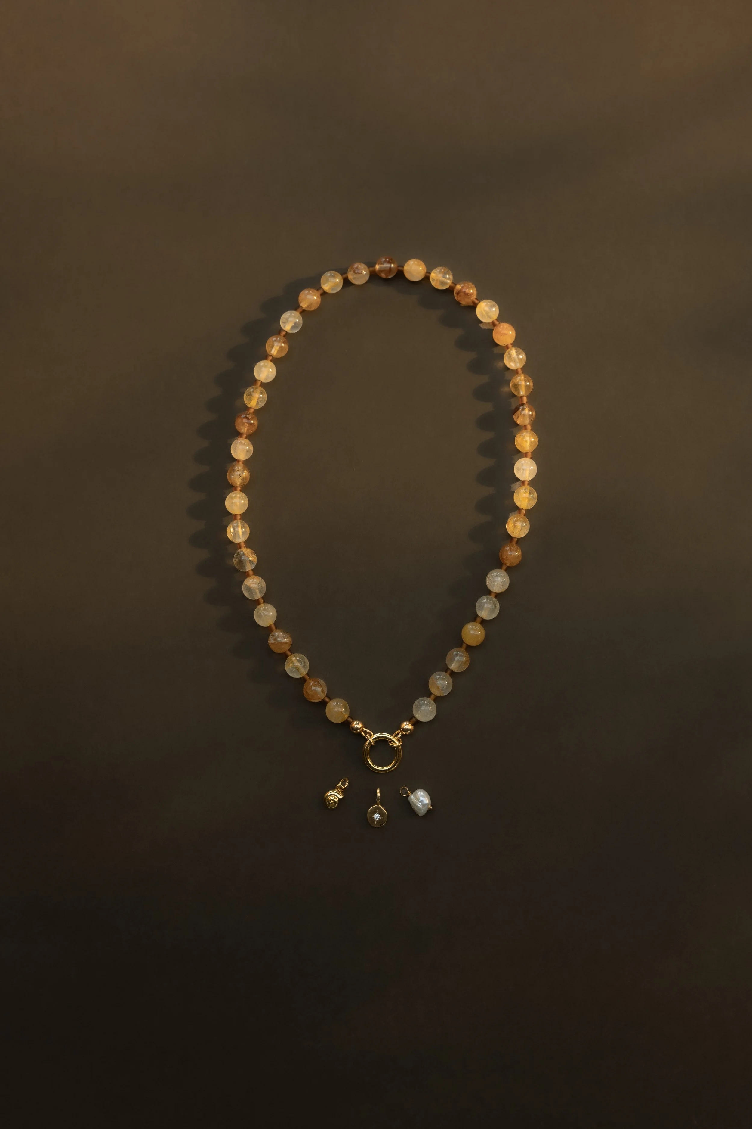 Citrine Necklace. Round faceted citrine gemstone beads with a personalised charm clasp. Finished with 14ct gold filled findings. Ochre Jewellery, handmade Byron Bay.